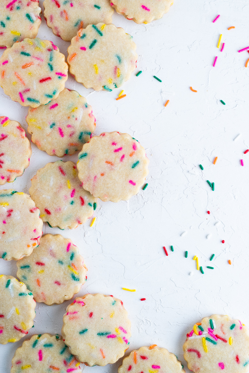A flatlay of cookies with sprinkles 