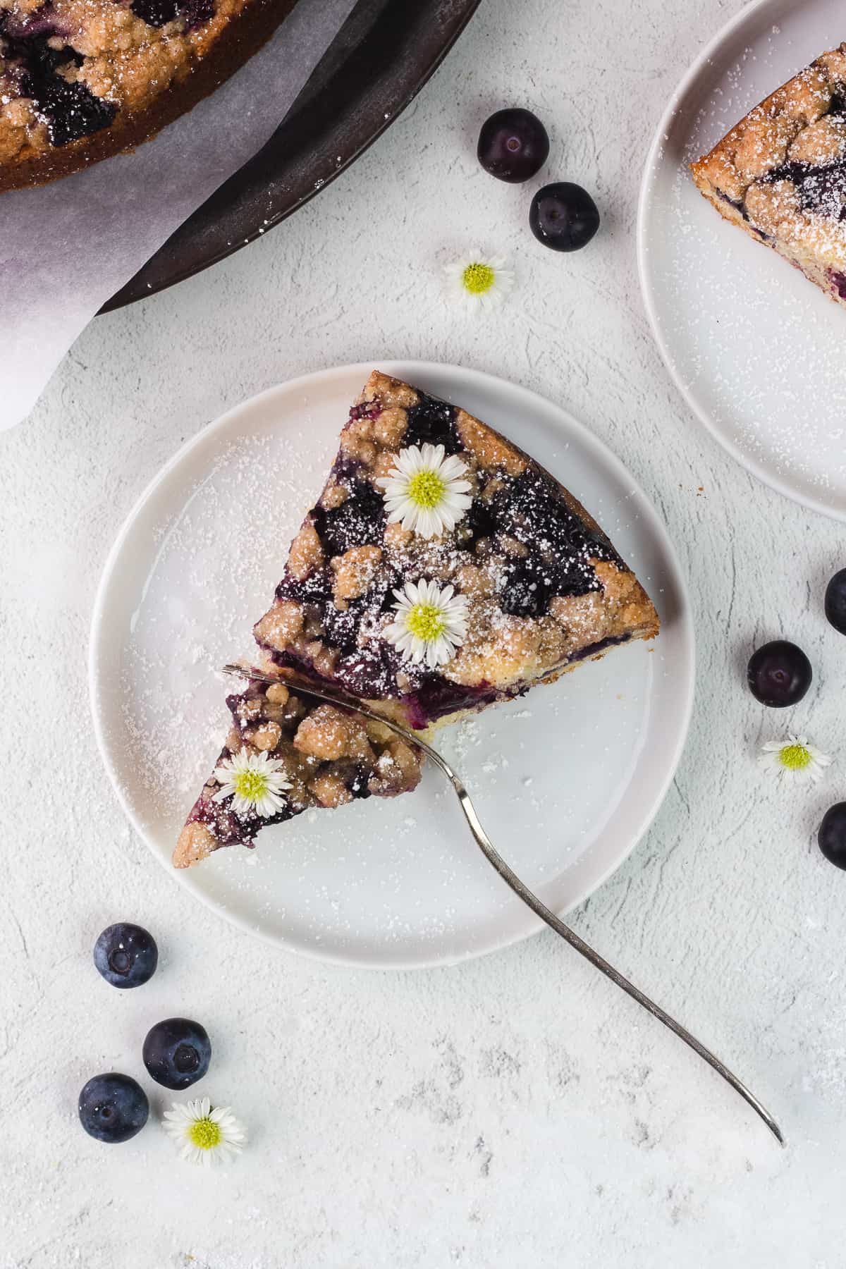 a slice of blueberry buckle cake