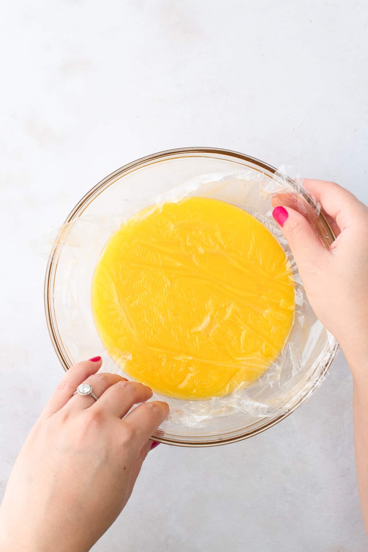 Easy Lemon Curd with plastic wrap on top