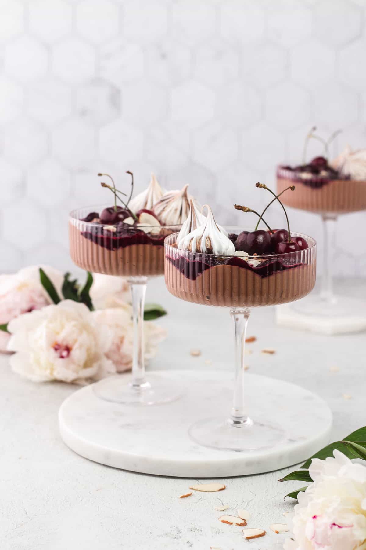 Three Black Forest Eton Mess in a coupe glass and on a round marble tray