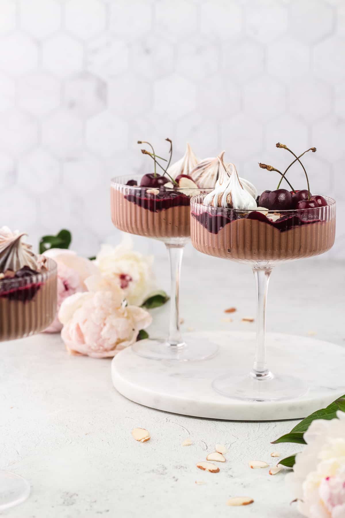 Three Black Forest Eton Mess in a coupe glass and on a round marble tray