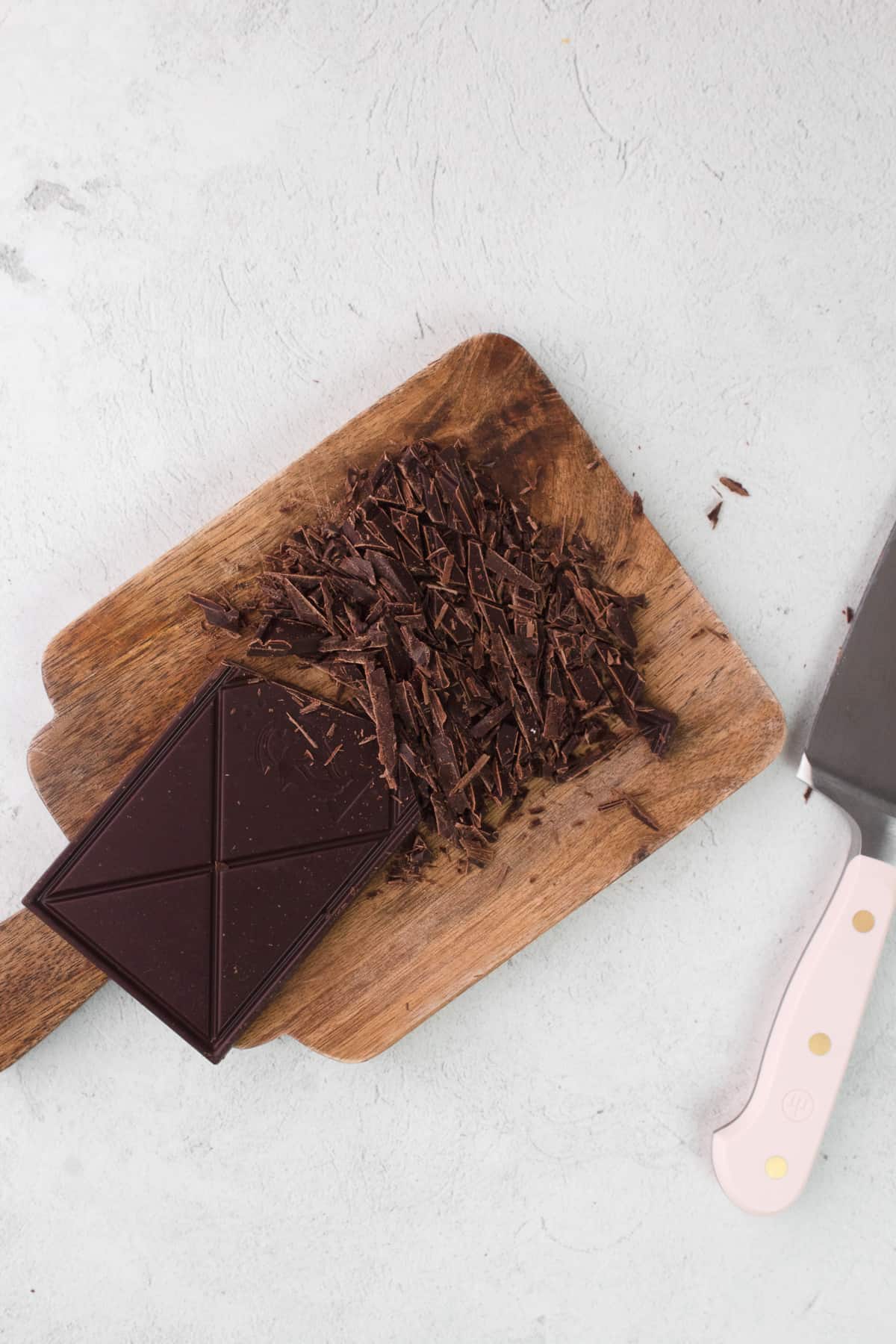 Chopped chocolate on a cutting board 