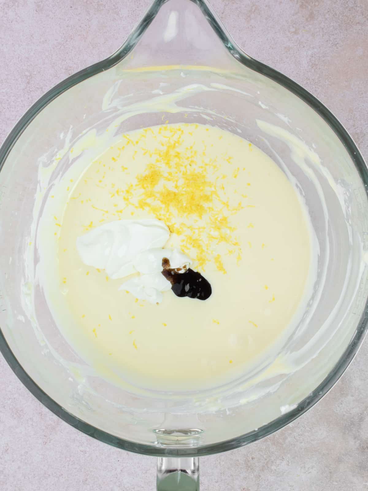 Sour cream, lemon zest and vanilla added to cream cheese