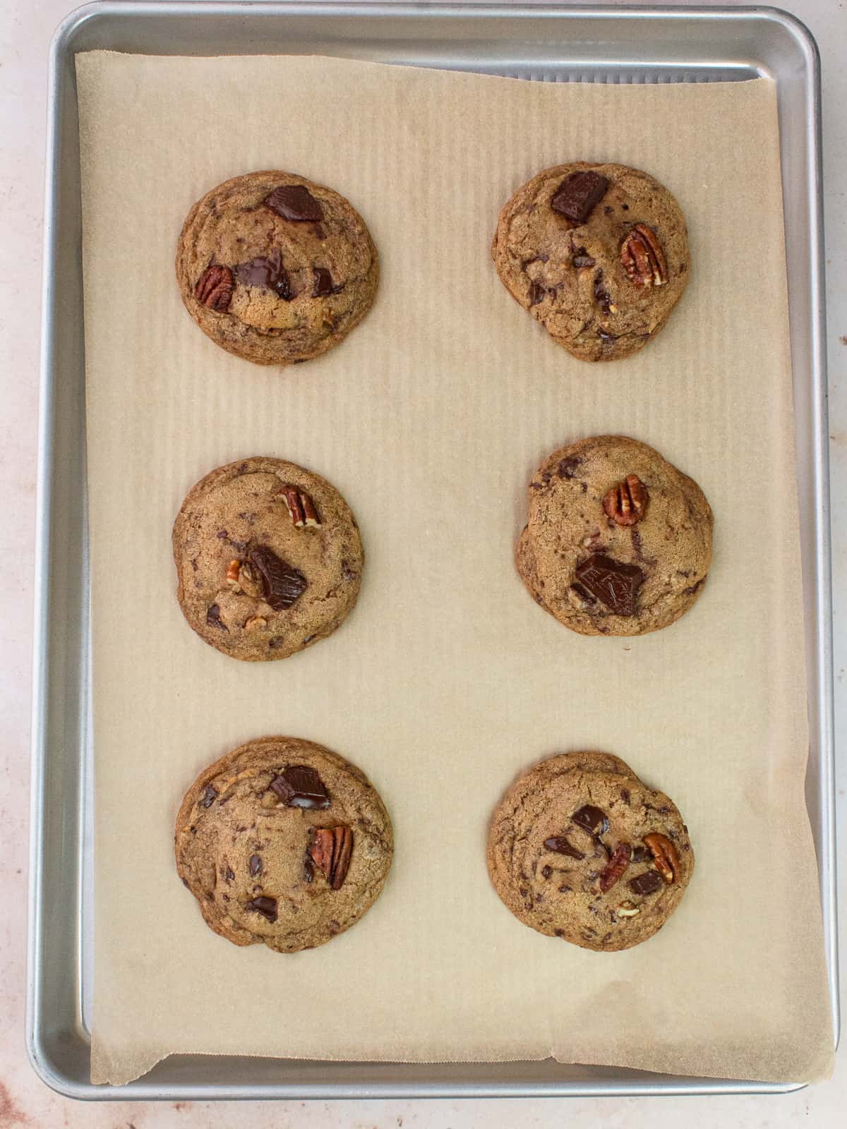 Baked cookies on parchment lined cookie sheet