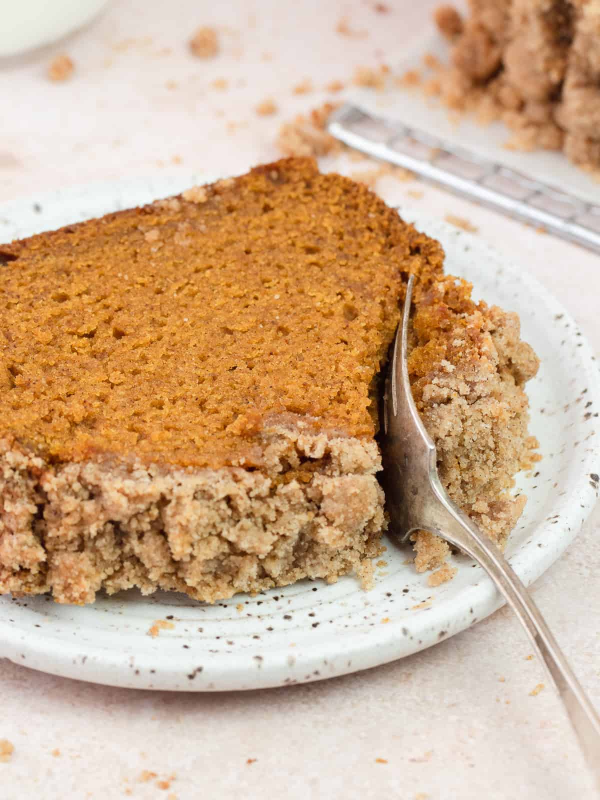 Slice of pumpkin bread on a plate with fork