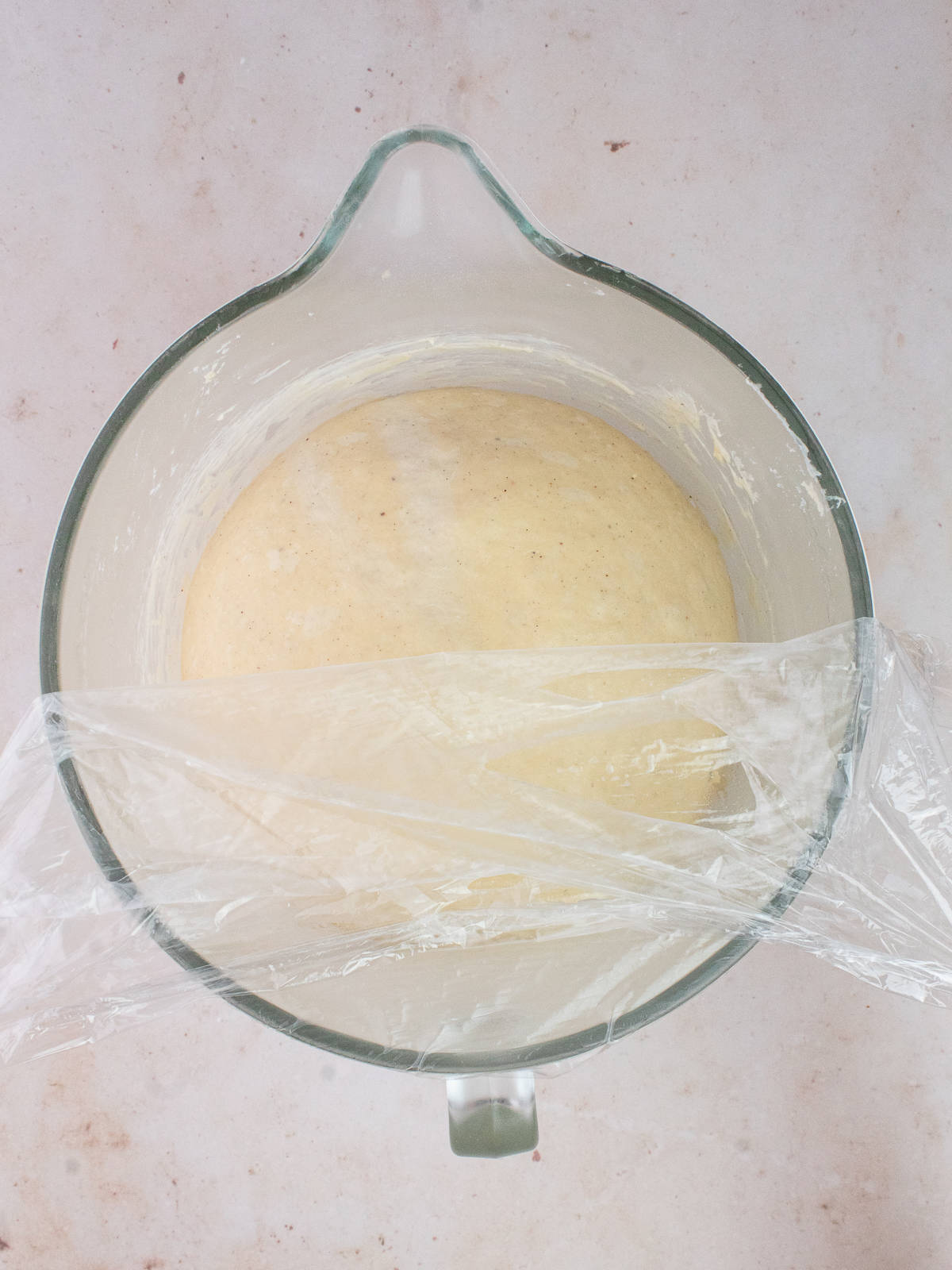 Proofed dough in glass bowl