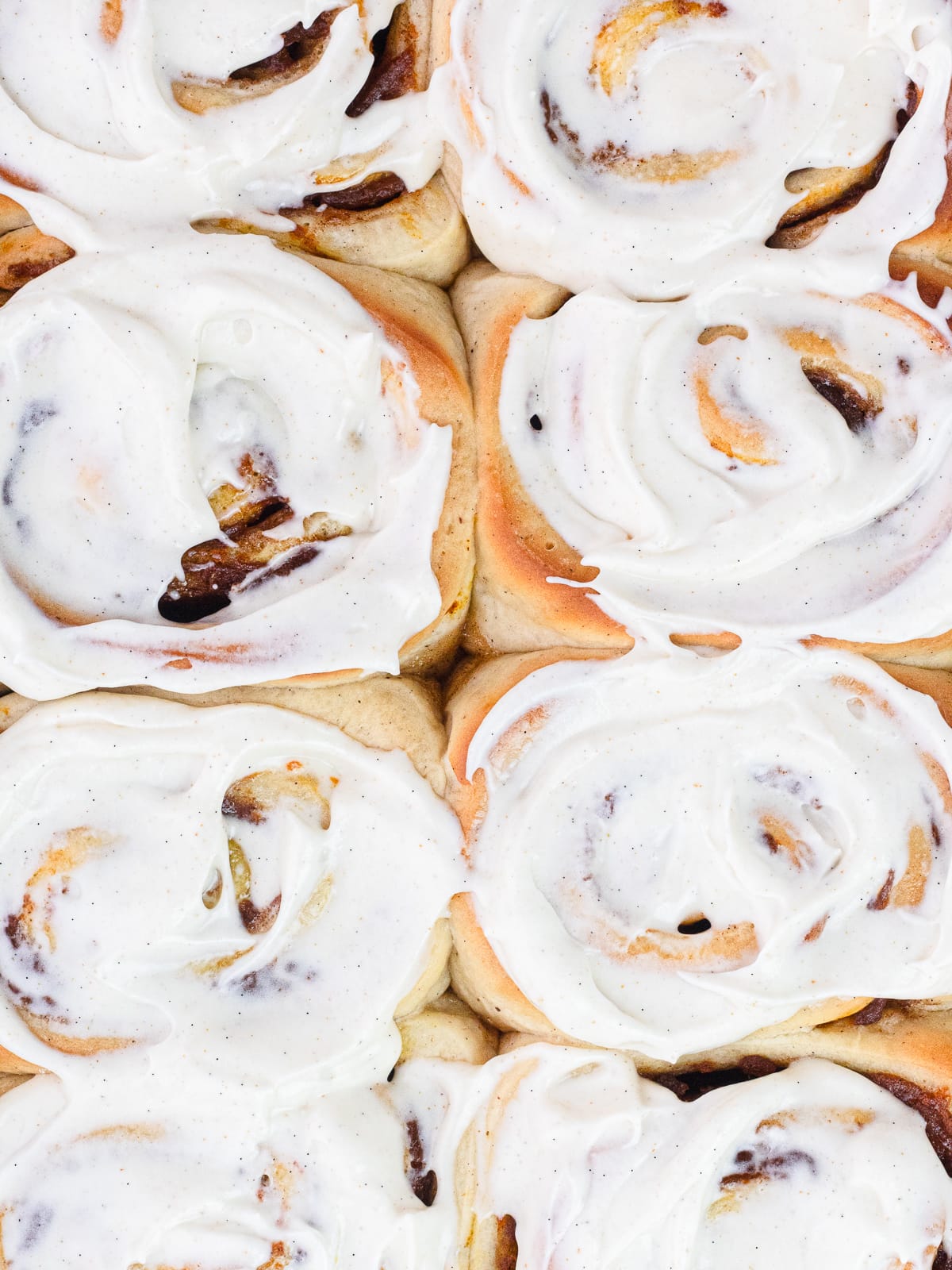 Close up of frosted cinnamon rolls