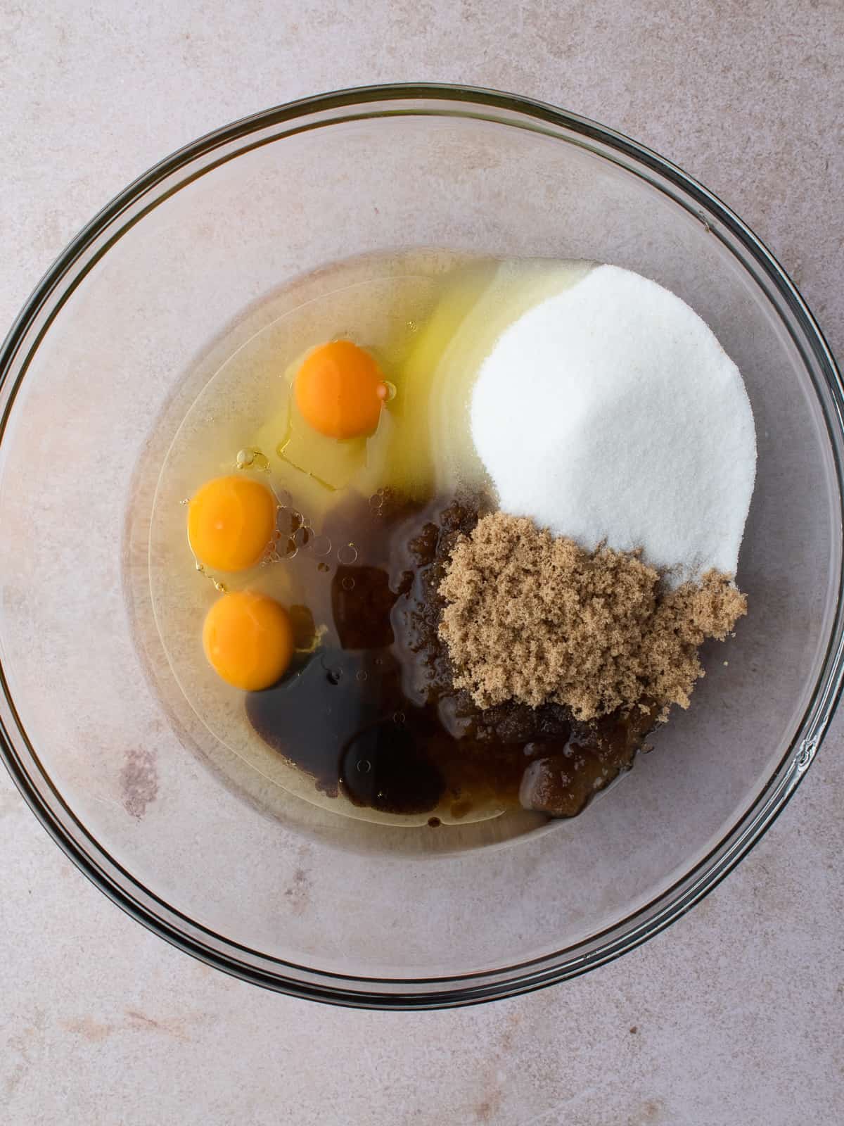 Olive oil, eggs, sugar and vanilla in large glass bowl