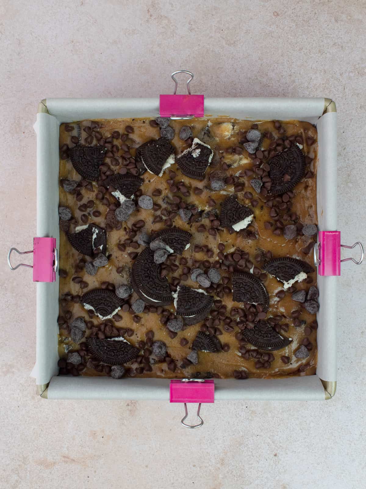 Oreo blondie batter in baking pan and ready for the oven