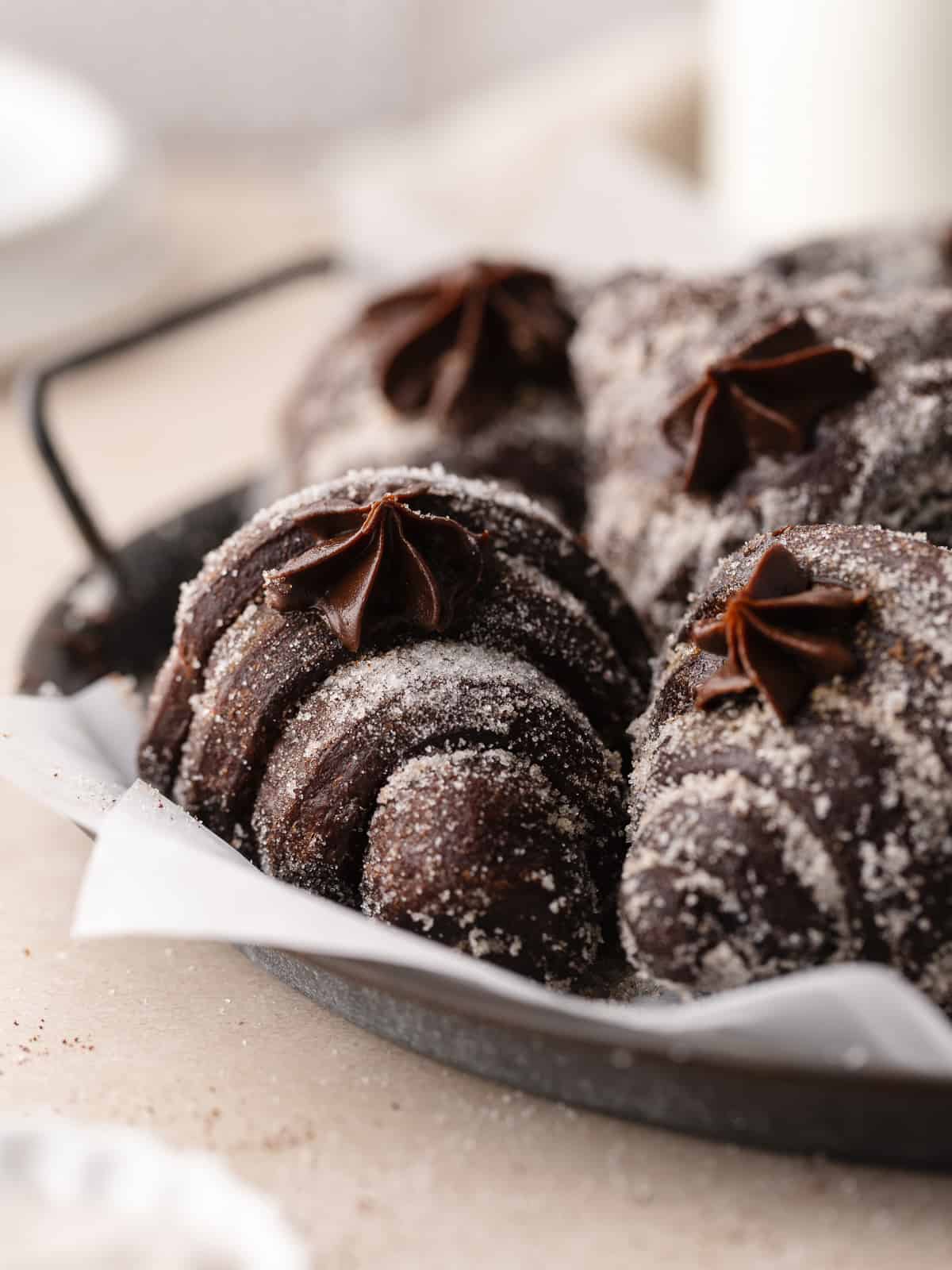 A tray of chocolate brioche donuts