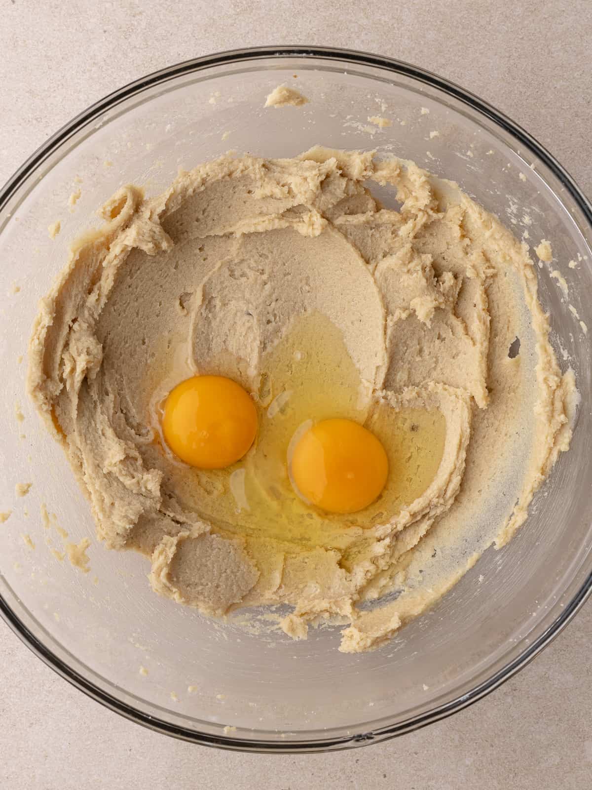 Egg and yolk is added to butter, sugar mixture