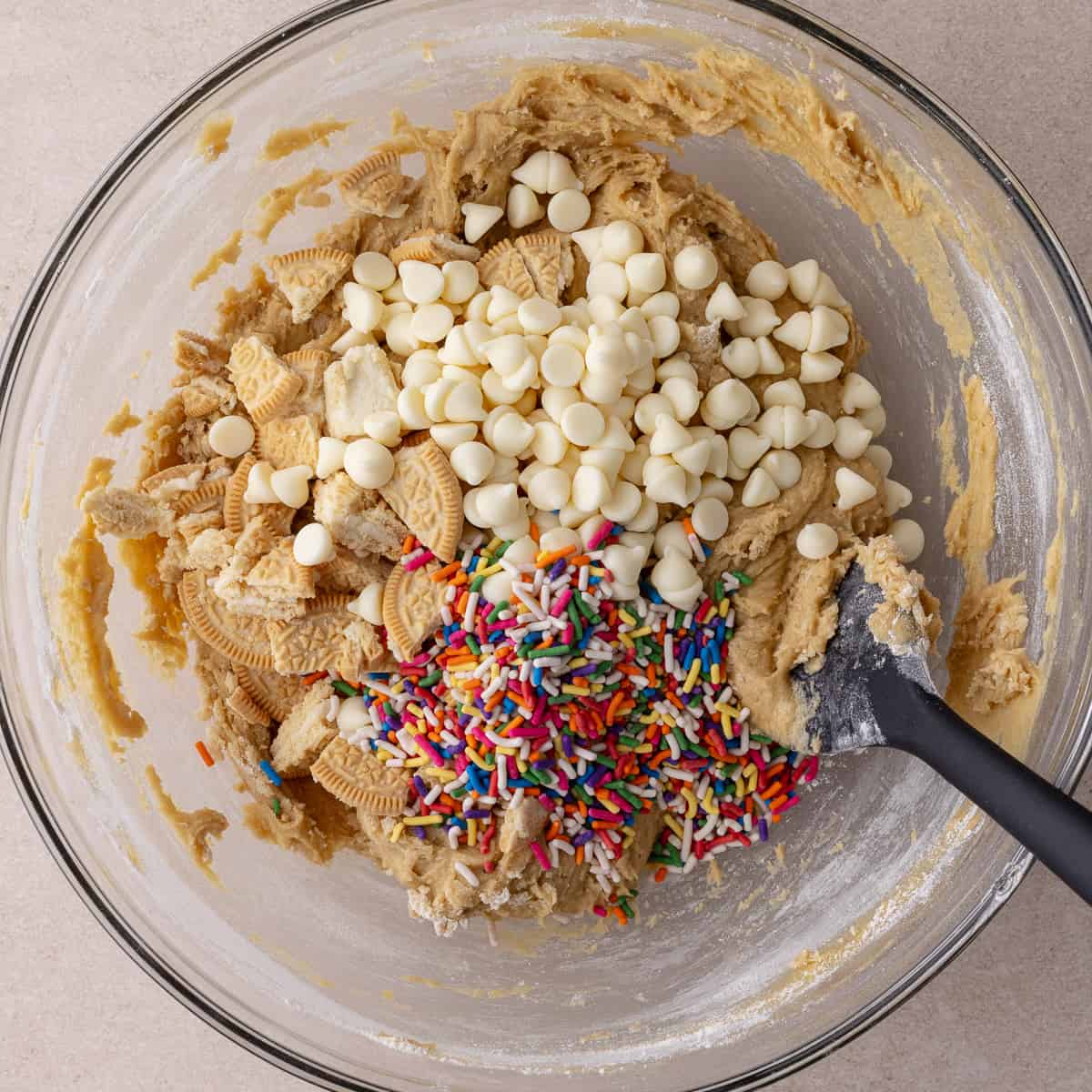 Crushed golden Oreos, sprinkles and white chocolate chips added to batter