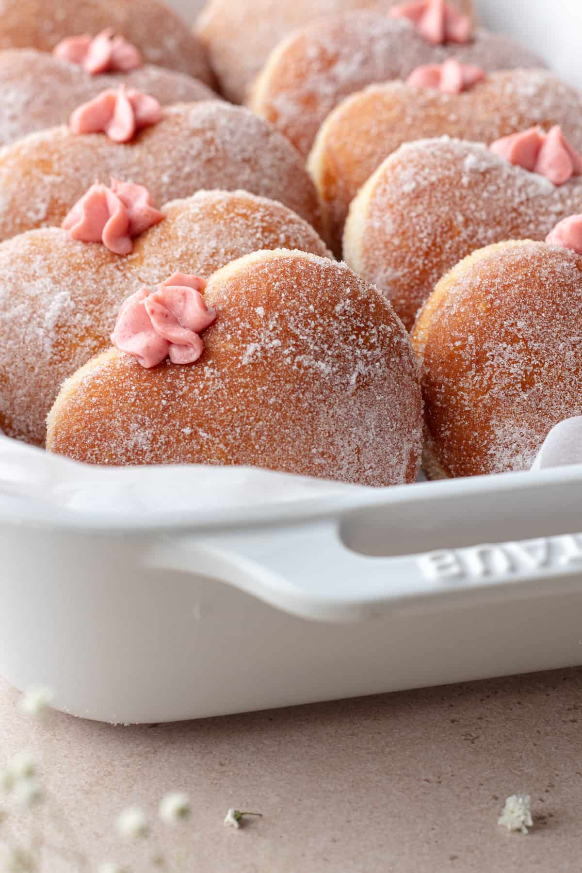 Strawberry cheesecake donuts in baking dish
