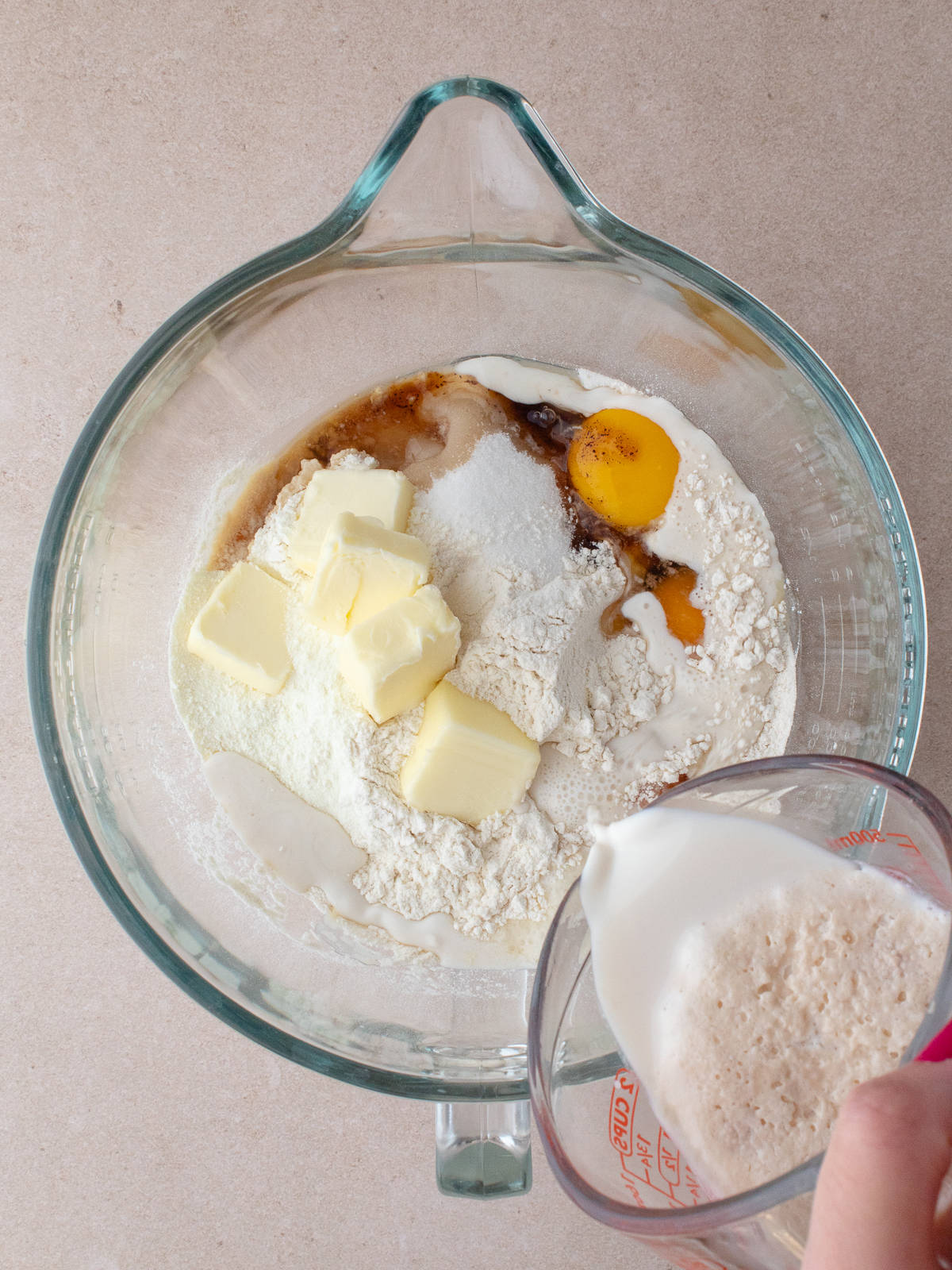 Flours, eggs, butter, sugar, vanilla, rum and yeast mixture in large mixing bowl