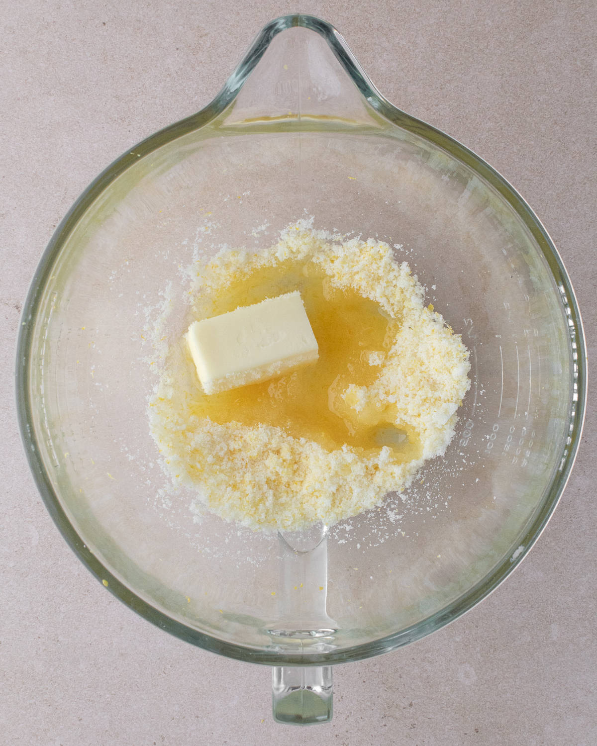 Sugar, lemon zest, butter and oil in a large glass mixing bowl
