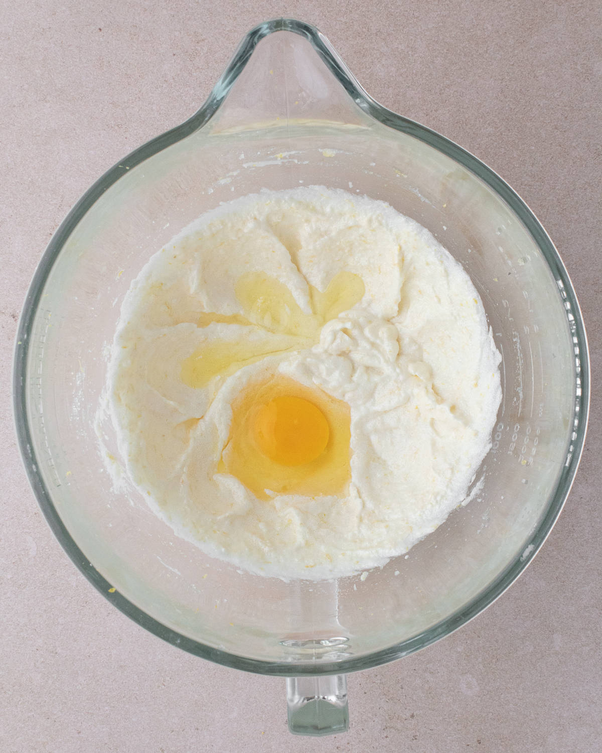 Egg is added to sugar, butter, oil mixture