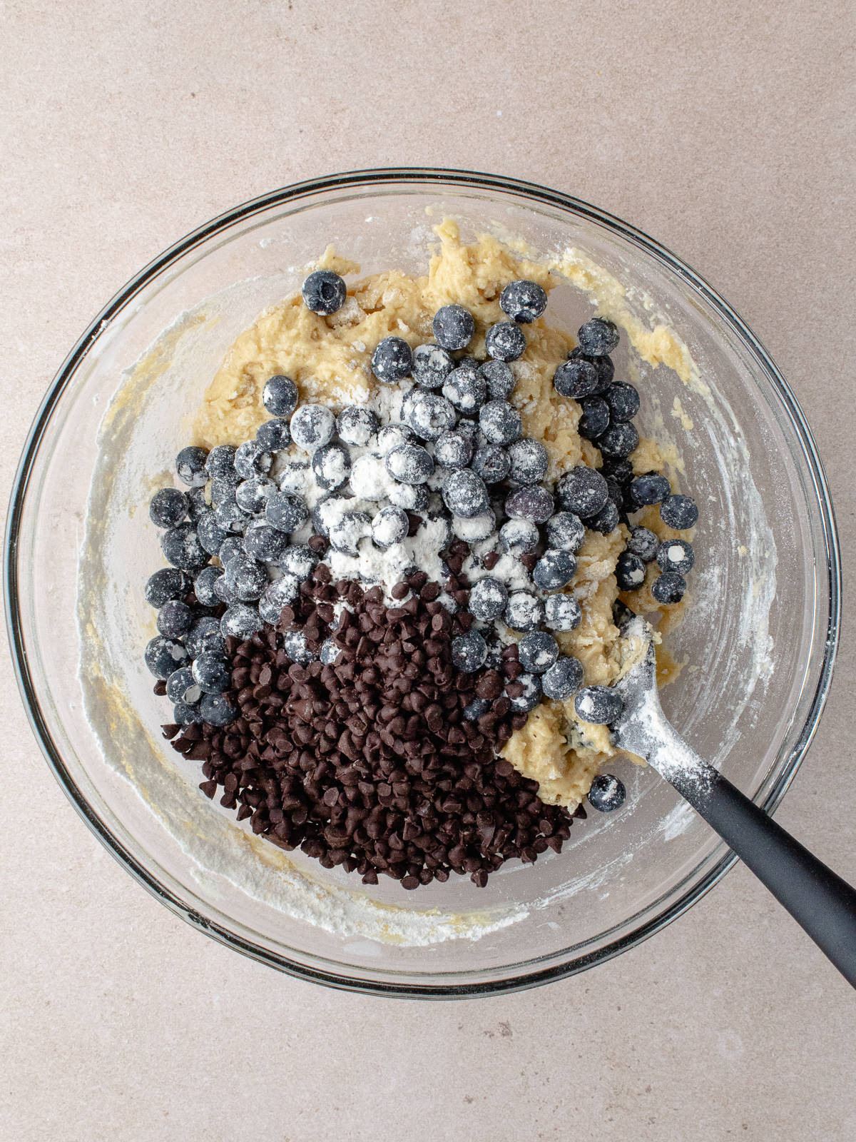 Flour Coated blueberries and mini chocolate chips are added to batter.