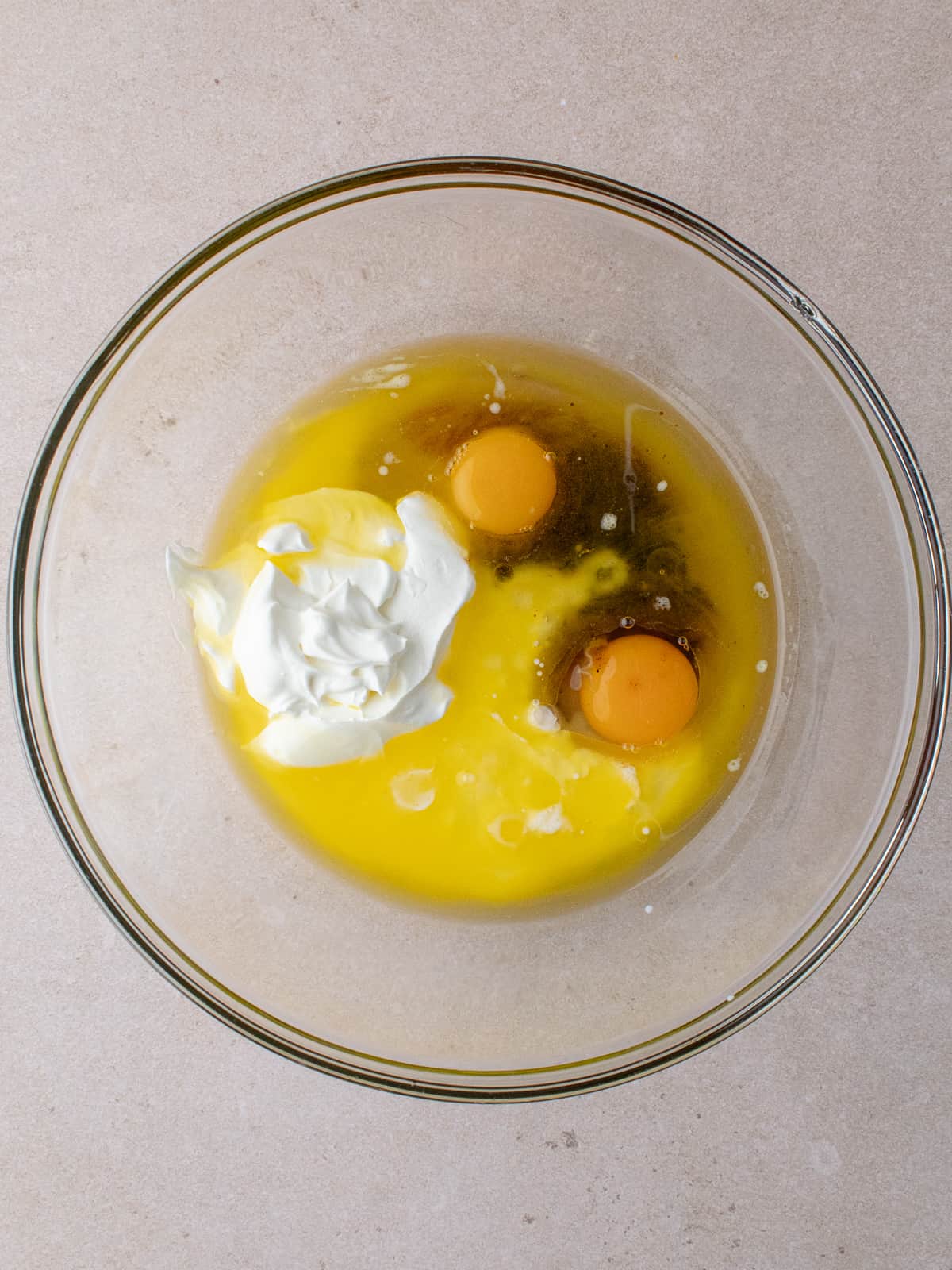 Melted butter, oil, sour cream, buttermilk, eggs and vanilla in a large bowl.