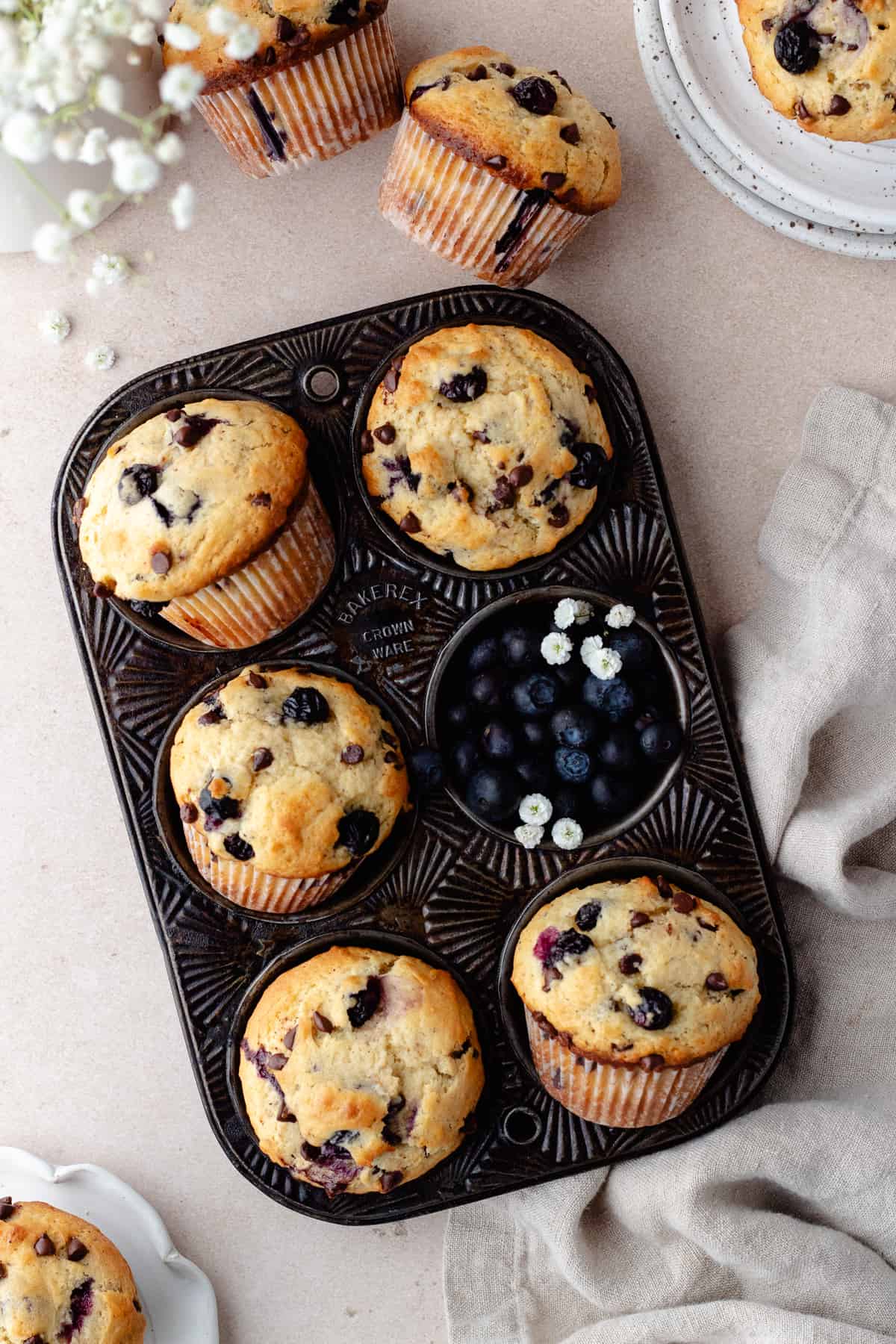Blueberry chocolate chip muffins in muffin pan.