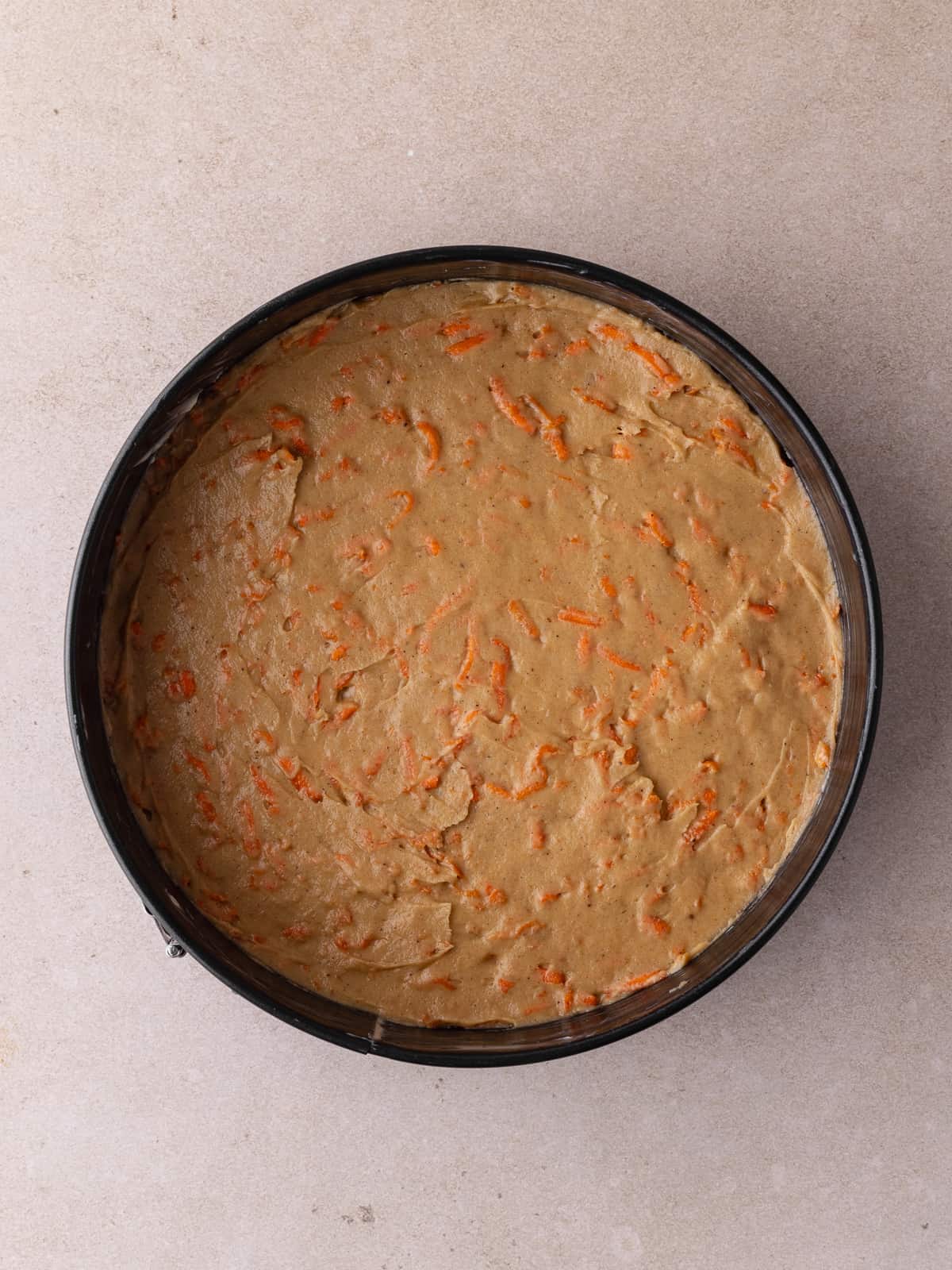 Carrot cake layer in springform pan.