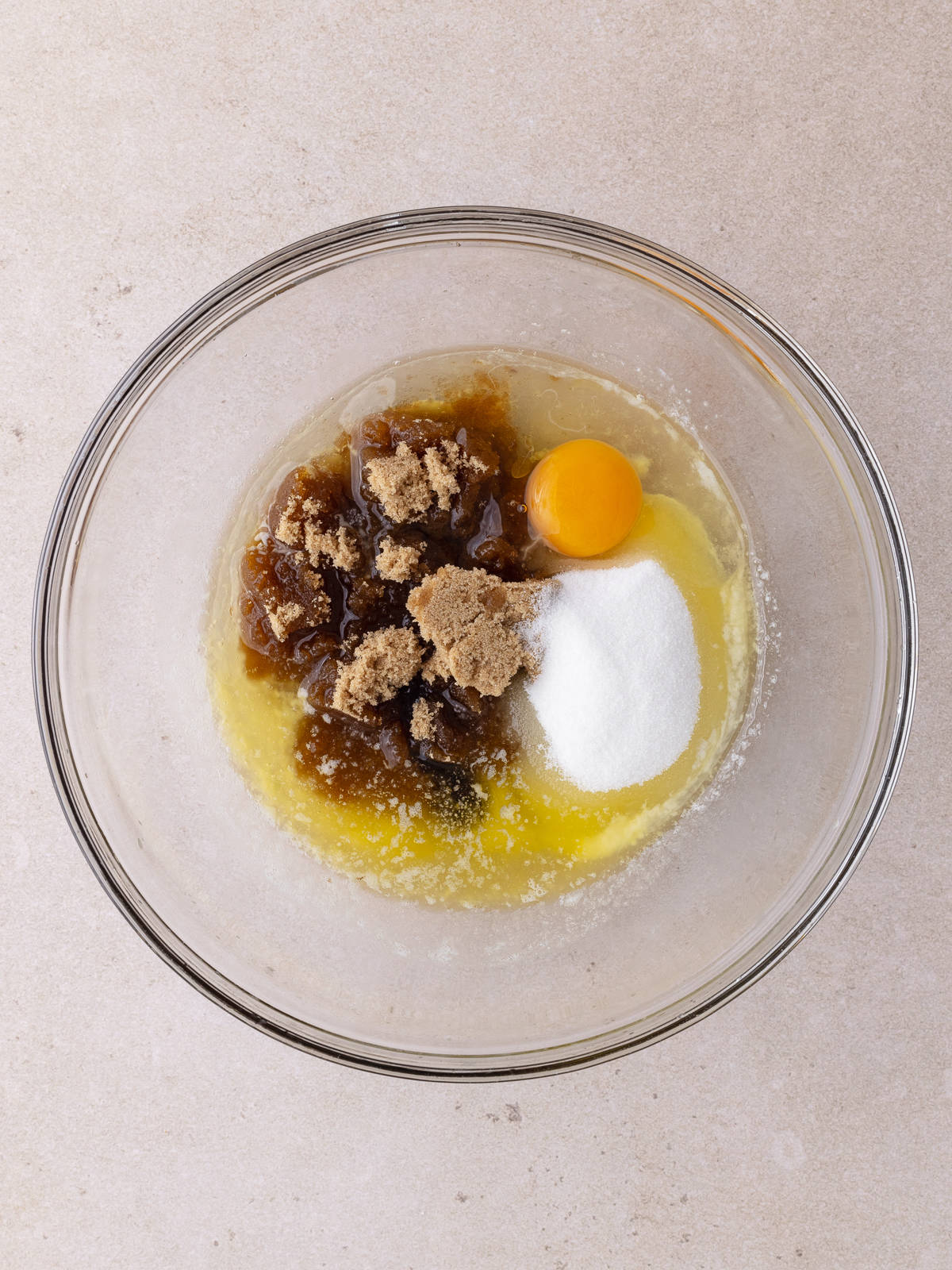 Melted butter, oil, brown sugar, white sugar, egg and vanilla in a medium bowl.