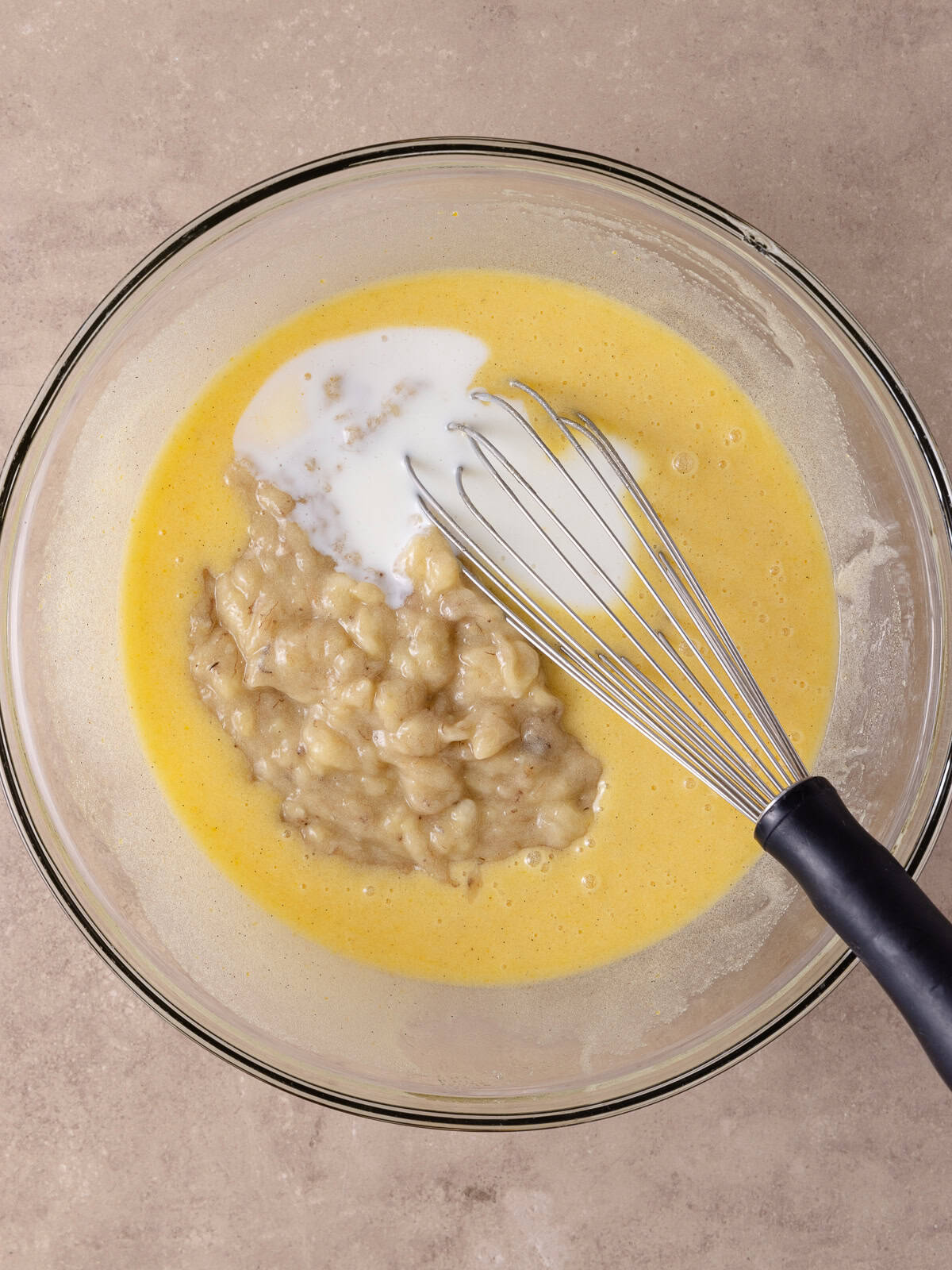 Mashed bananas and buttermilk is added to the mixture.