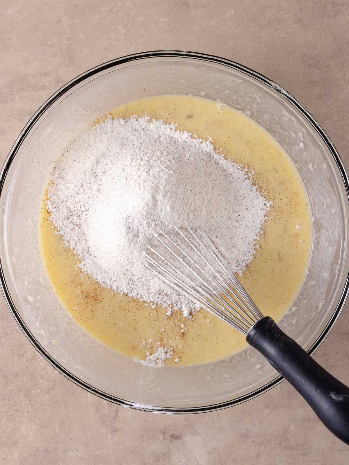 Dry ingredients, which is flour, espresso, salt, baking powder and baking soda is sifted into the wet ingredients.