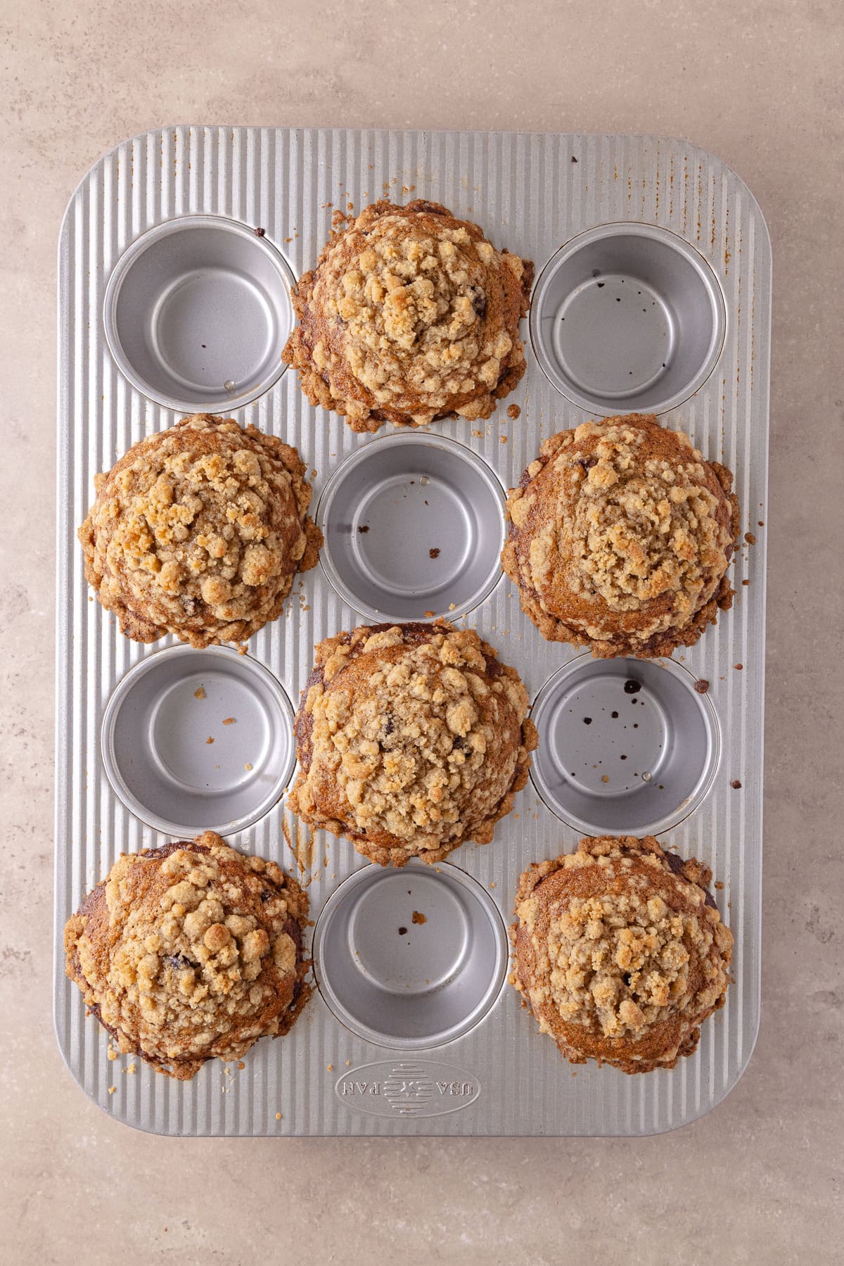 Banana espresso muffins are fully baked and are in the muffin pan.
