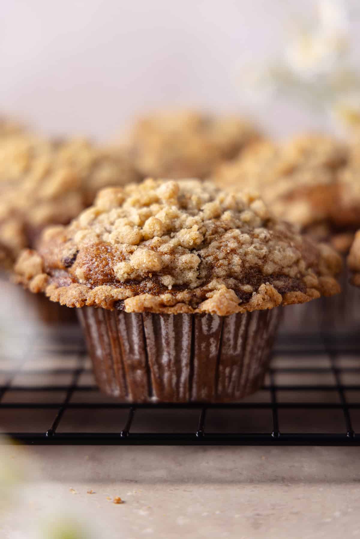 Close up of Banana Espresso Muffins on top of a cooling rack.
