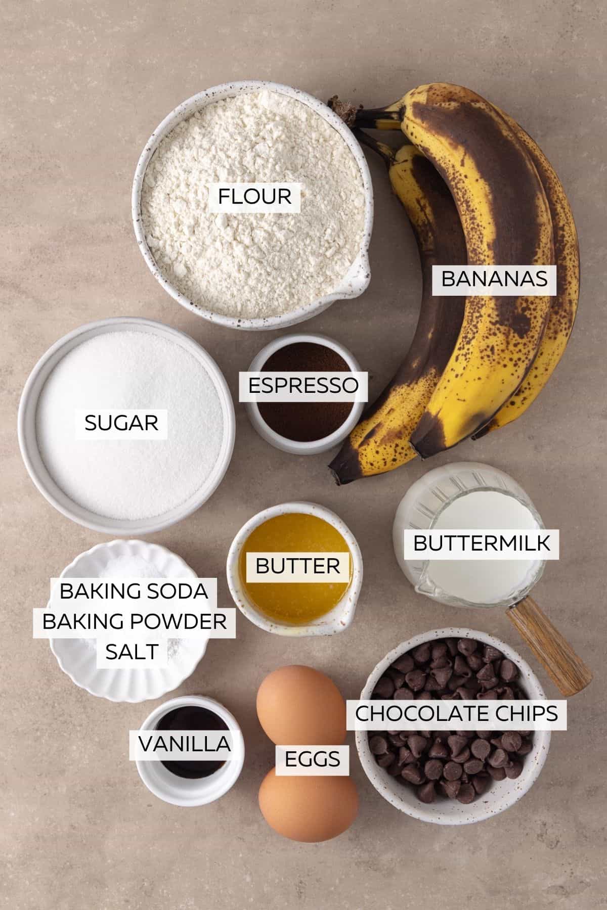 Ingredients for Banana Espresso Muffins - Flour, baking soda, baking powder, salt, bananas, buttermilk, eggs, butter, vanilla, espresso powder and chocolate chips.