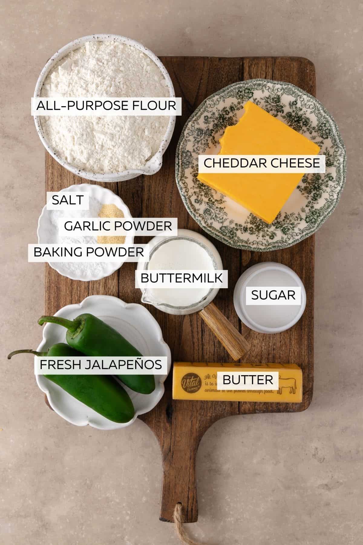 Jalapeno Cheddar Biscuits ingredients, which include, all-purpose flour, baking powder, sugar, salt, garlic powder, cheddar cheese, butter, buttermilk and jalapenos.