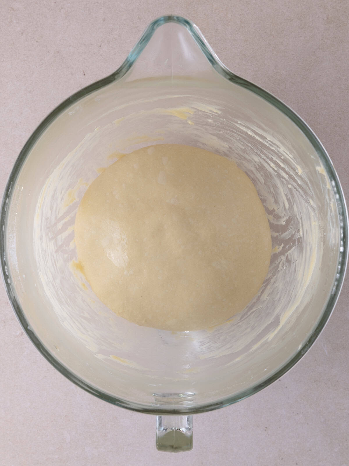 Dough has been formed into a smooth ball and placed in an oiled bowl and ready for the first rise.