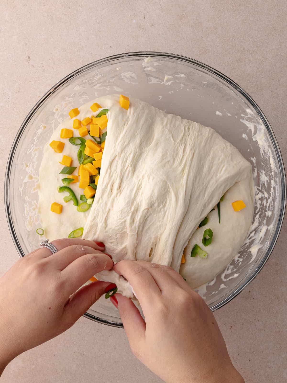 The dough is folded over and onto itself.