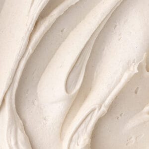 Close up of cinnamon maple cream cheese frosting featured photo.