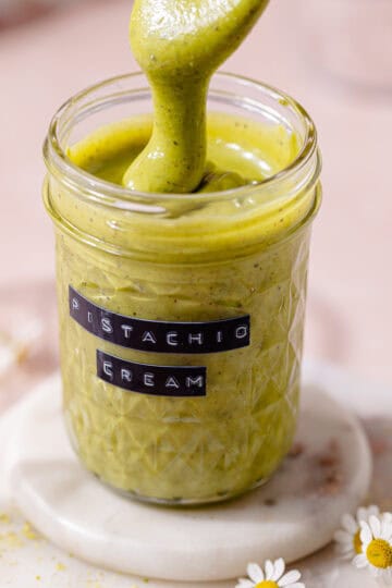 Easy homemade pistachio cream in a mason jar, feature photo.