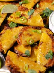 Pan fried crispy bean and cheese tacos feature photo.