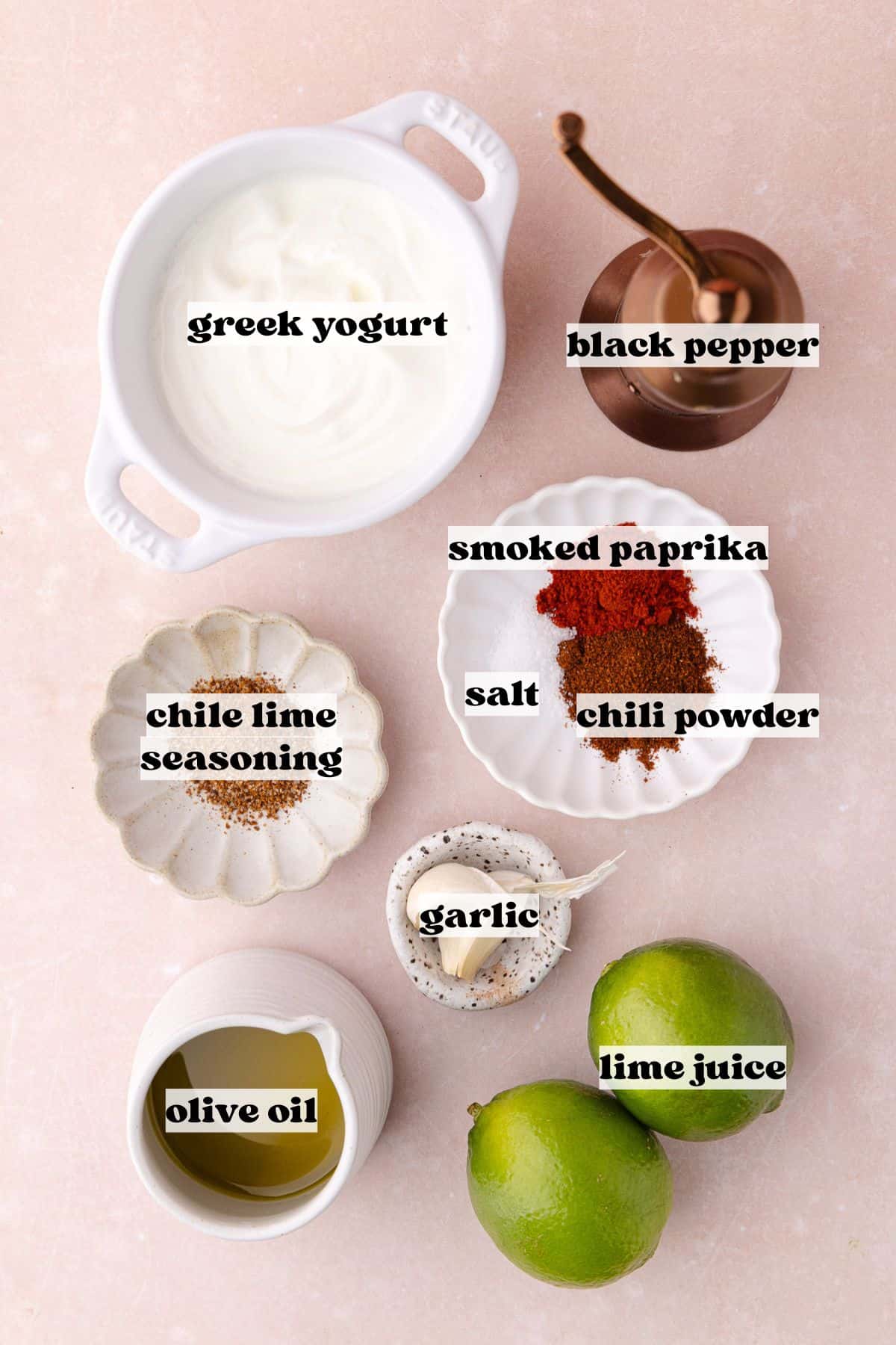 Elote pasta salad creamy dressing ingredients which include, Greek yogurt, olive oil, lime juice, garlic, smoked paprika, chili powder, salt, pepper and chile lime seasoning.