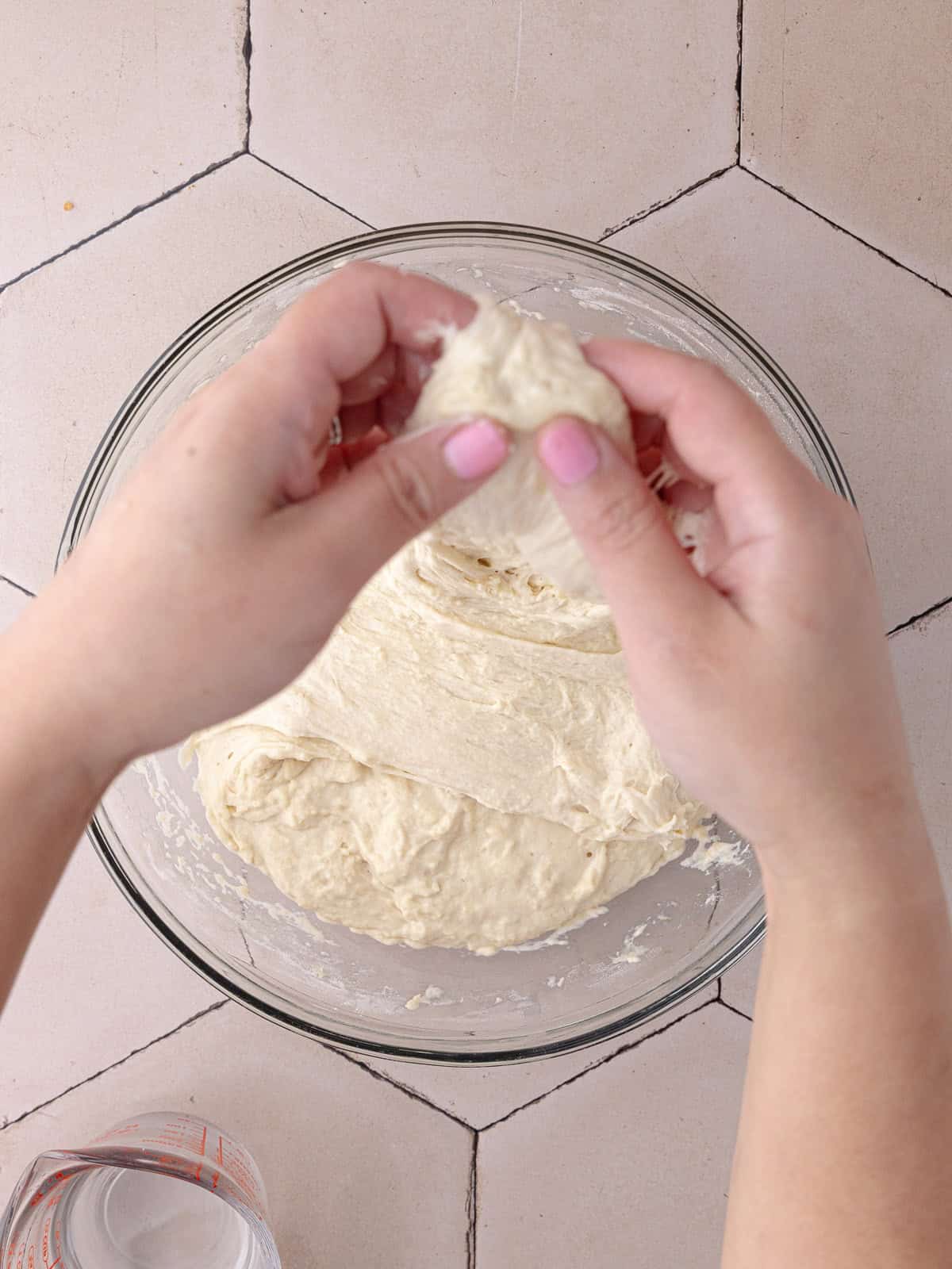 The schiacciata bread dough goes through a set of 4 stretch and folds to strengthen the structure.