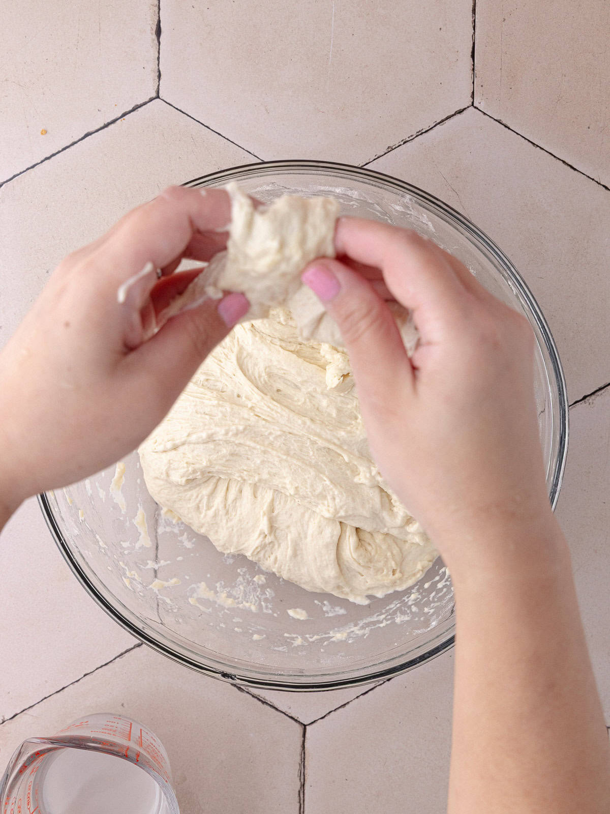 The schiacciata bread dough goes through a set of 4 stretch and folds to strengthen the structure.