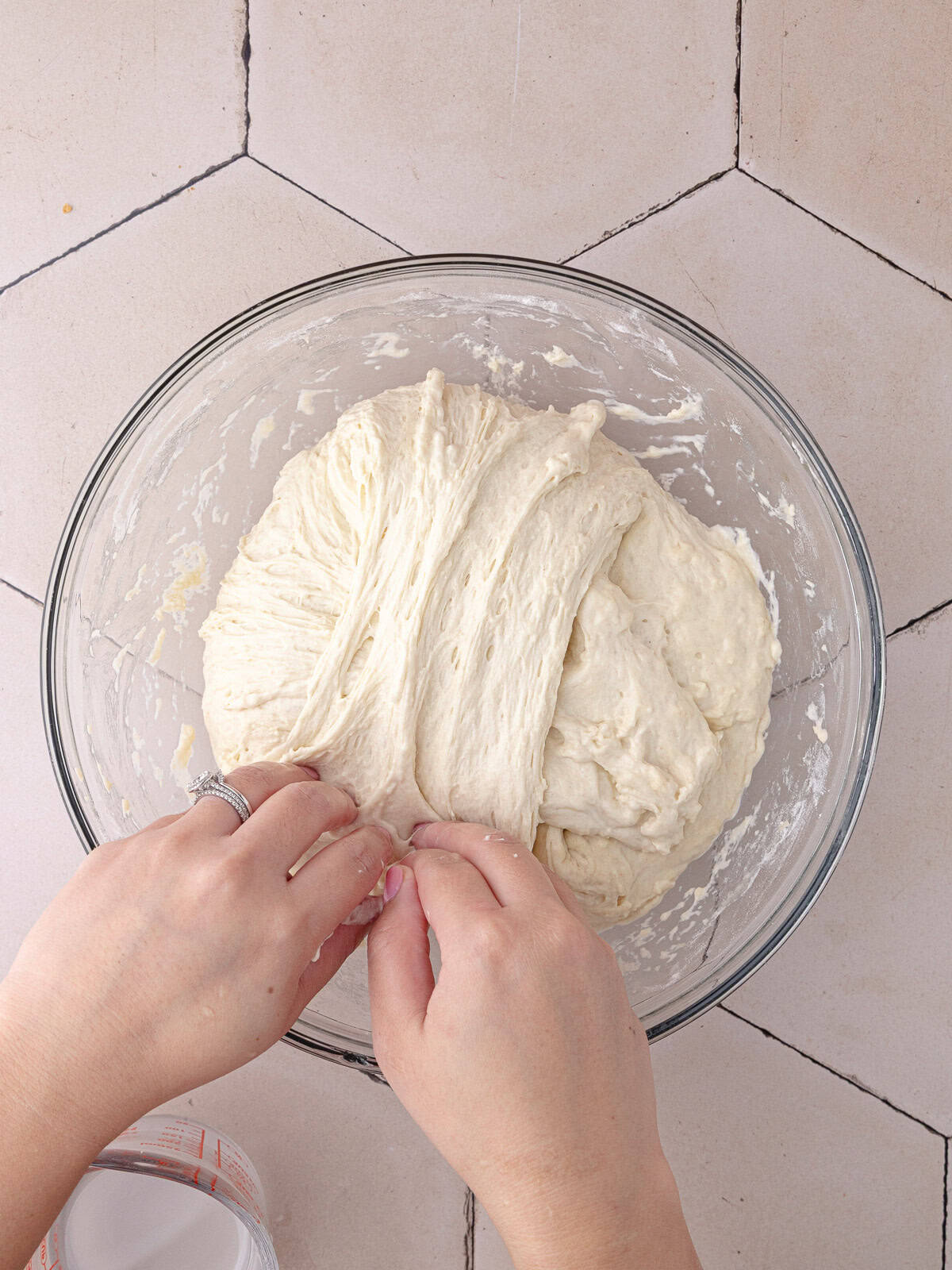 The schiacciata bread dough goes through a set of 4 stretch and folds to strengthen the structure.