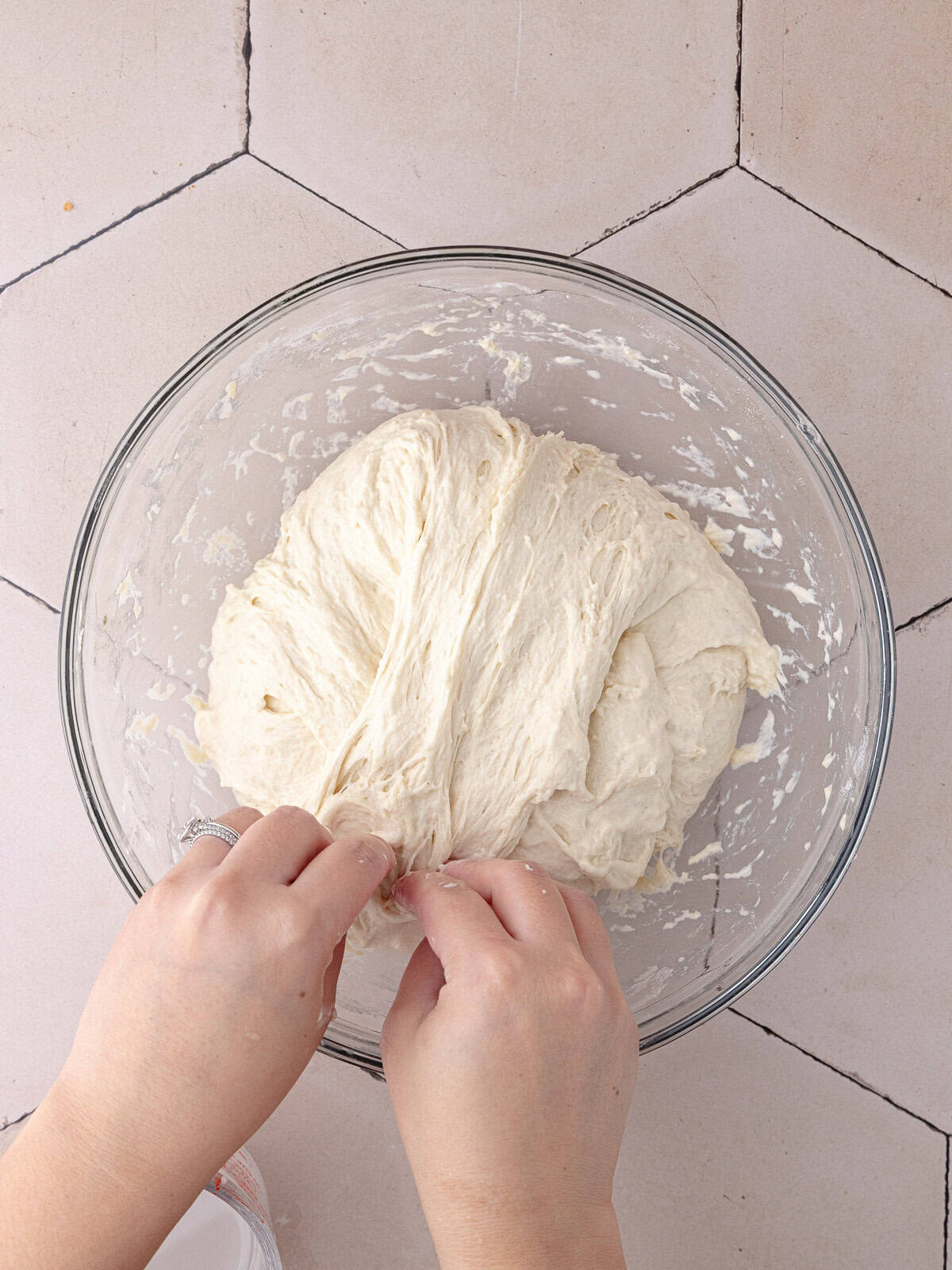 The schiacciata bread dough goes through a set of 4 stretch and folds to strengthen the structure.