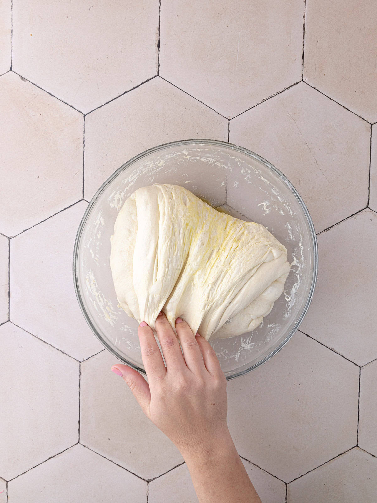 After overnight bulk fermentation, the dough gets a final stretch and fold.