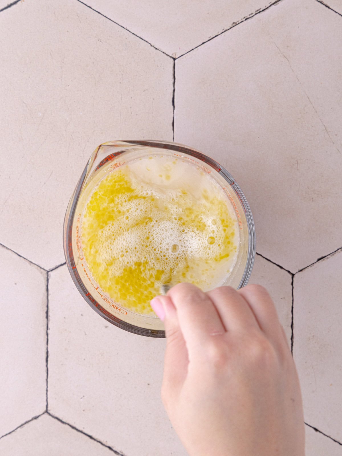 Olive oil and salt are mixed together with the yeast mixture.