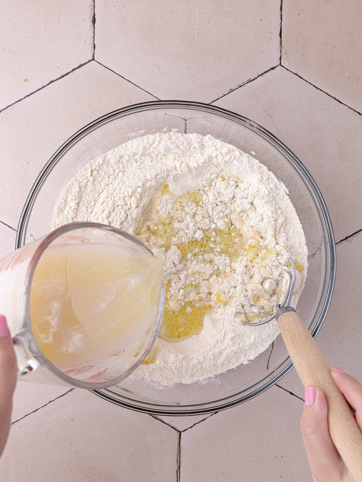 Yeast mixture is combined with bread flour and all-purpose flour.