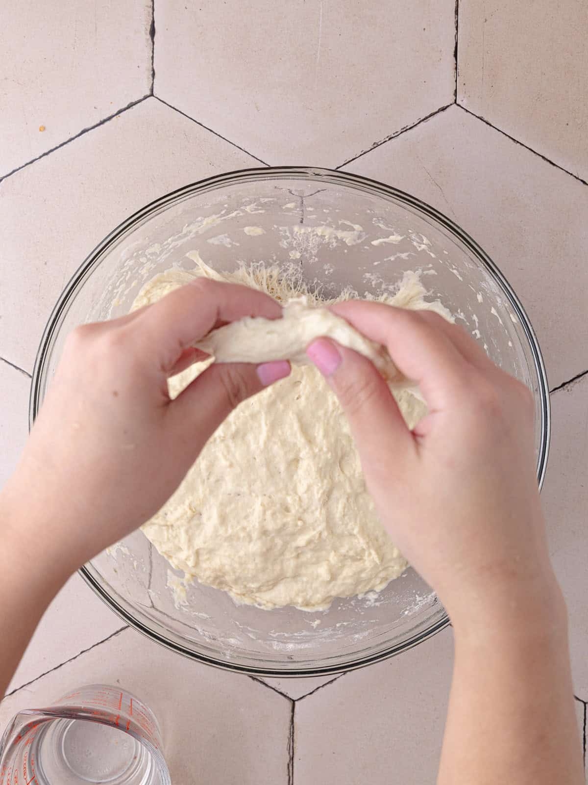The schiacciata bread dough goes through a set of 4 stretch and folds to strengthen the structure.