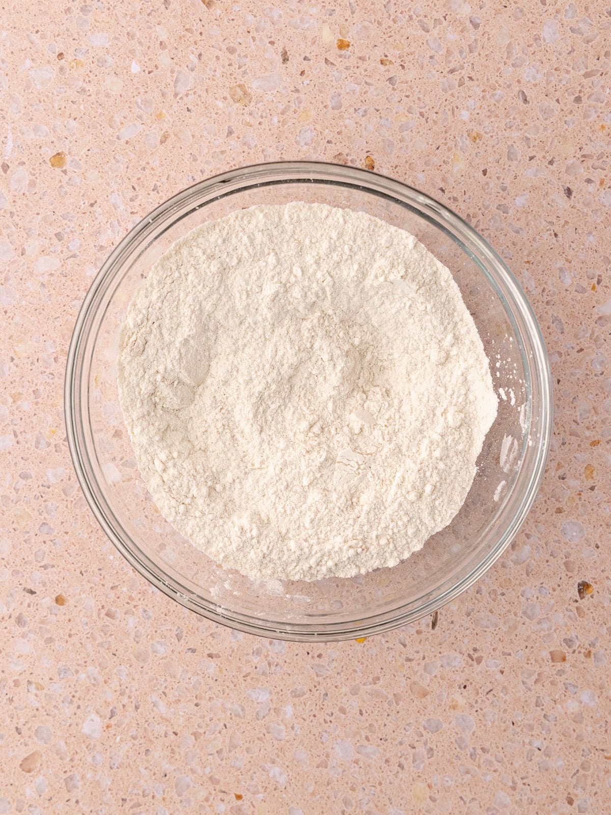 All-purpose flour, cinnamon, baking powder, baking soda and salt are whisked together in a small bowl.