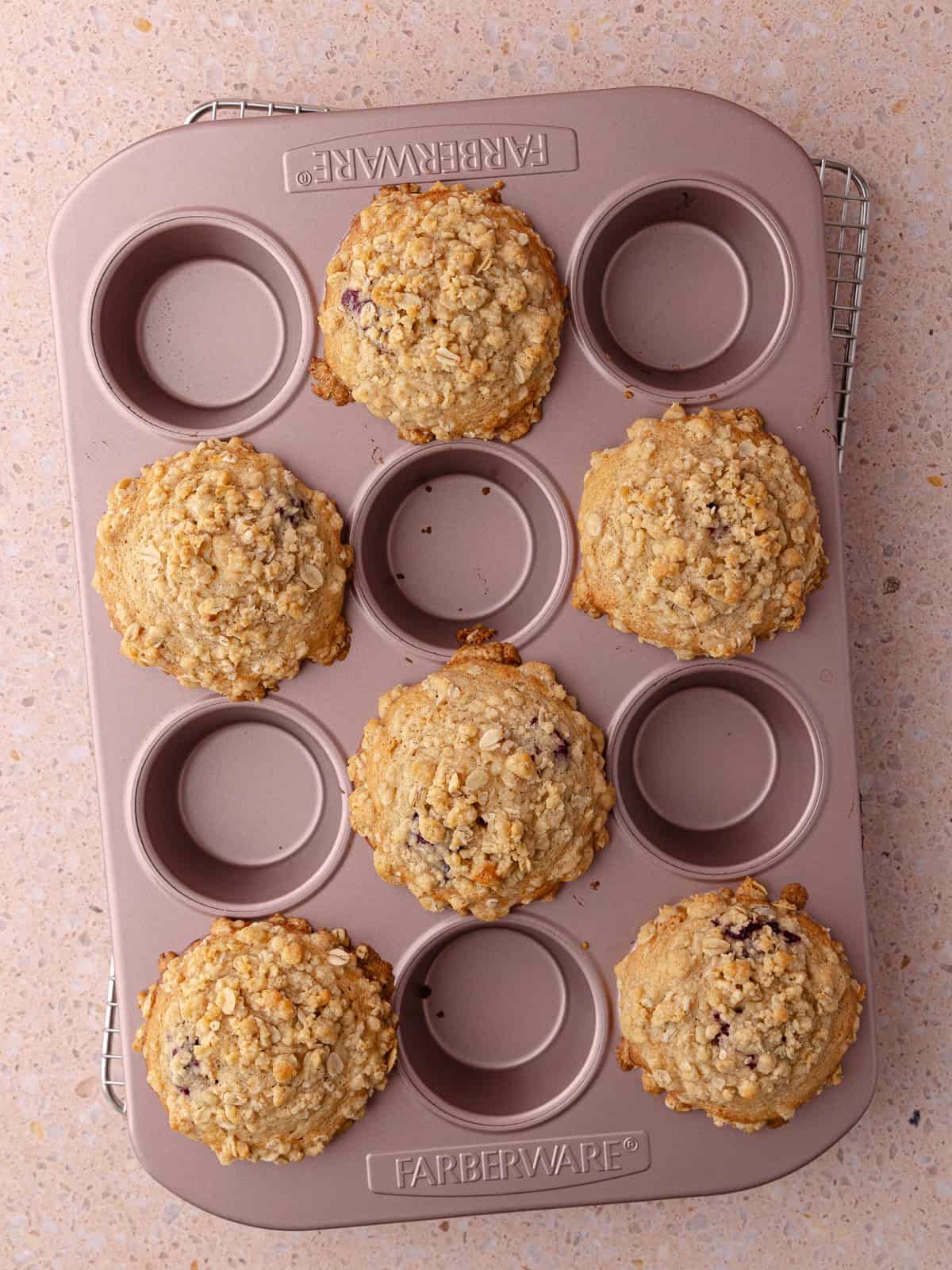 Banana blackberry oatmeal muffin baked in a muffin tin.