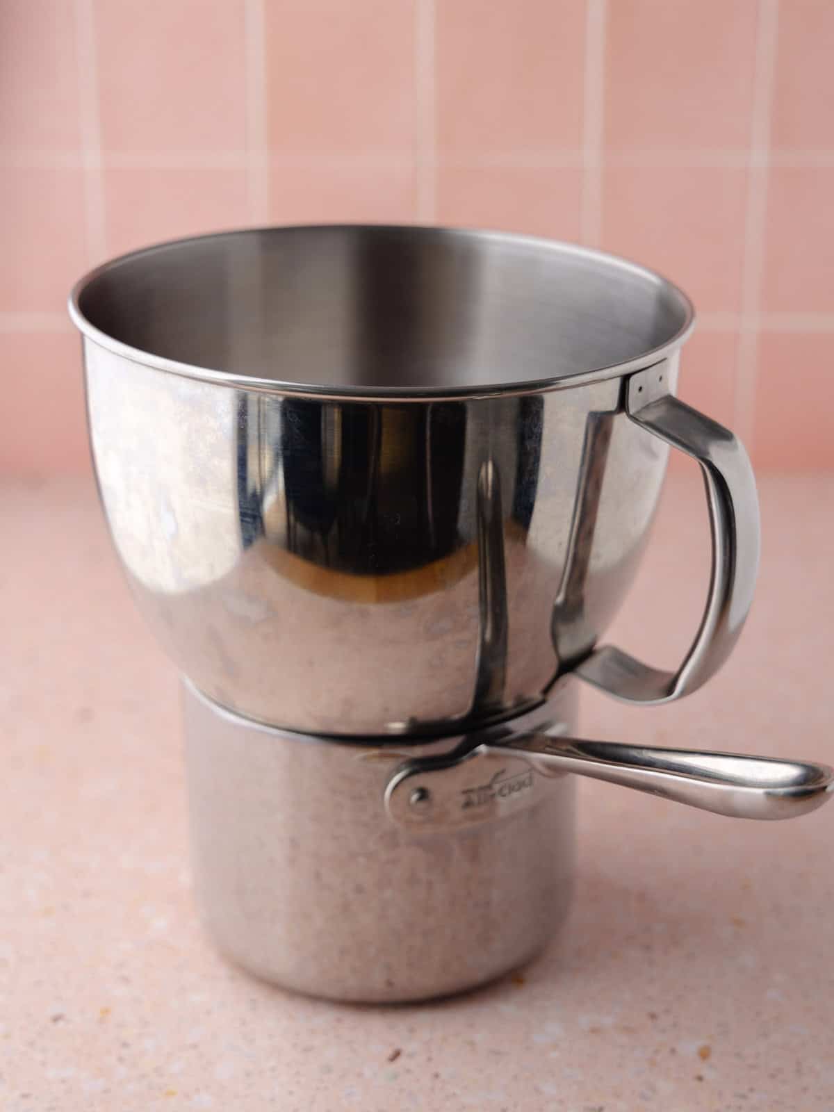 Homemade marshmallow meringue is made by cooking the egg whites and sugar over a double boiler.