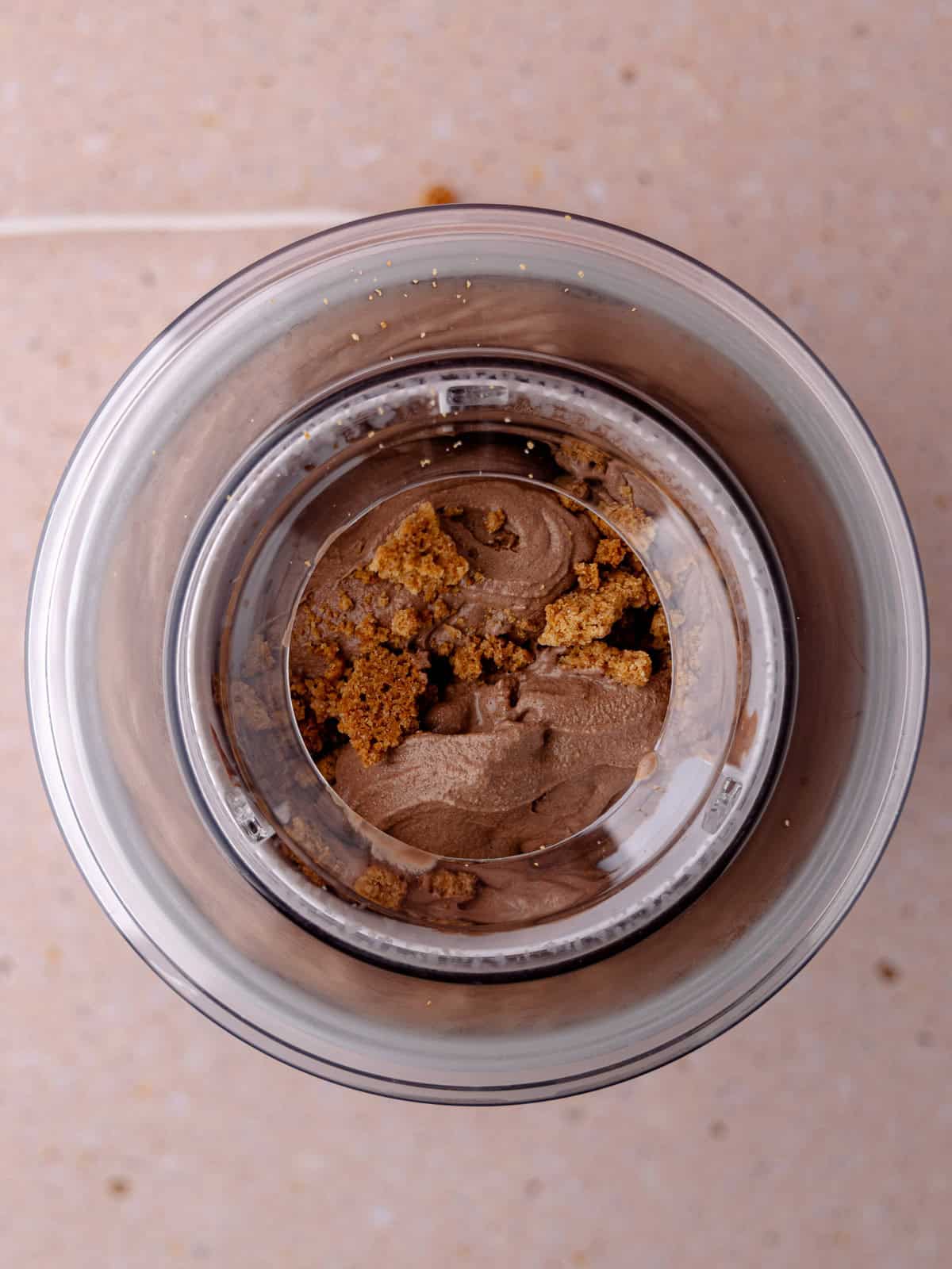 Crispy buttery graham crackers are added to the ice cream machine.