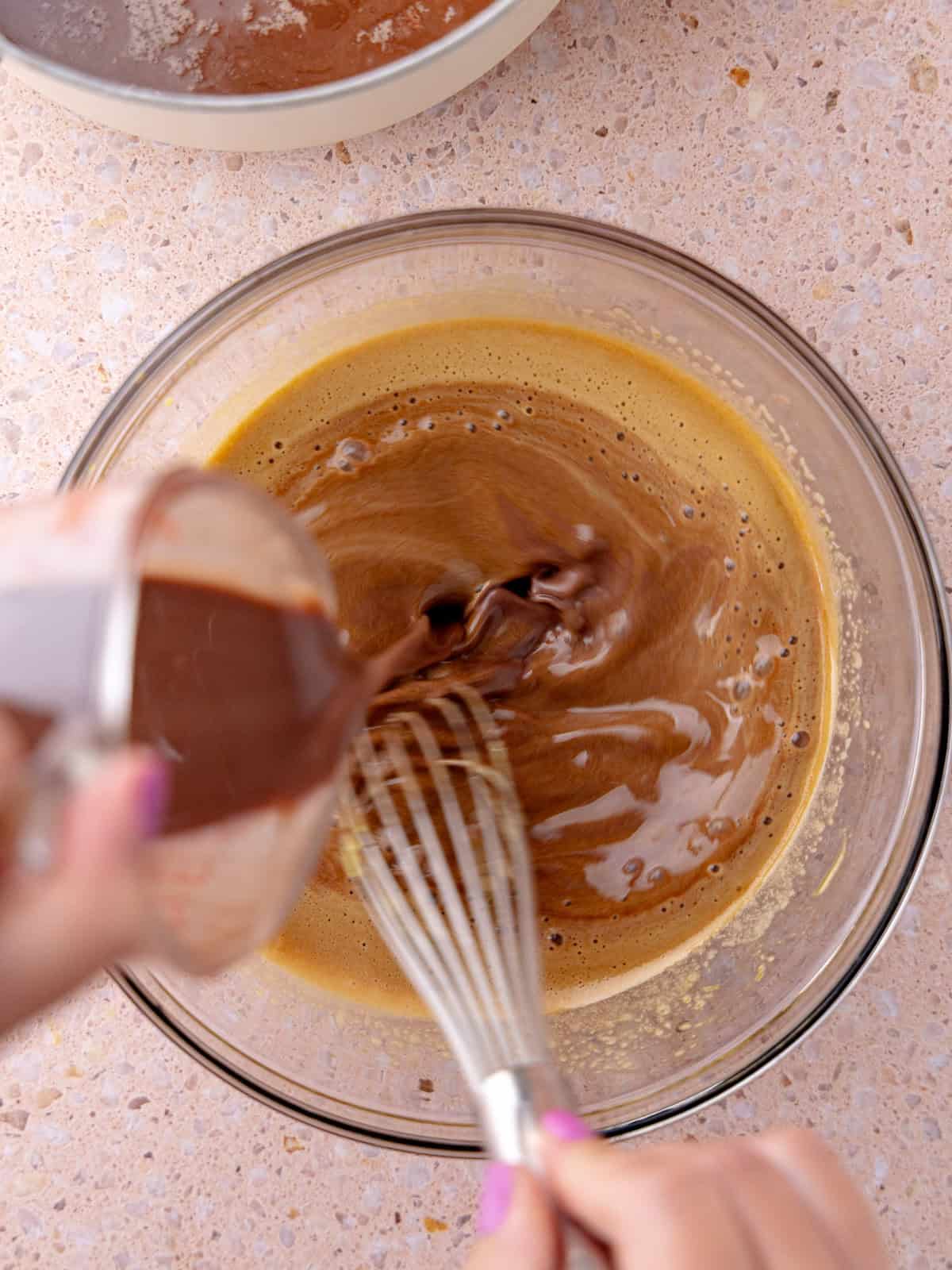 Egg yolks are tempered with the chocolate heavycream/milk mixture.